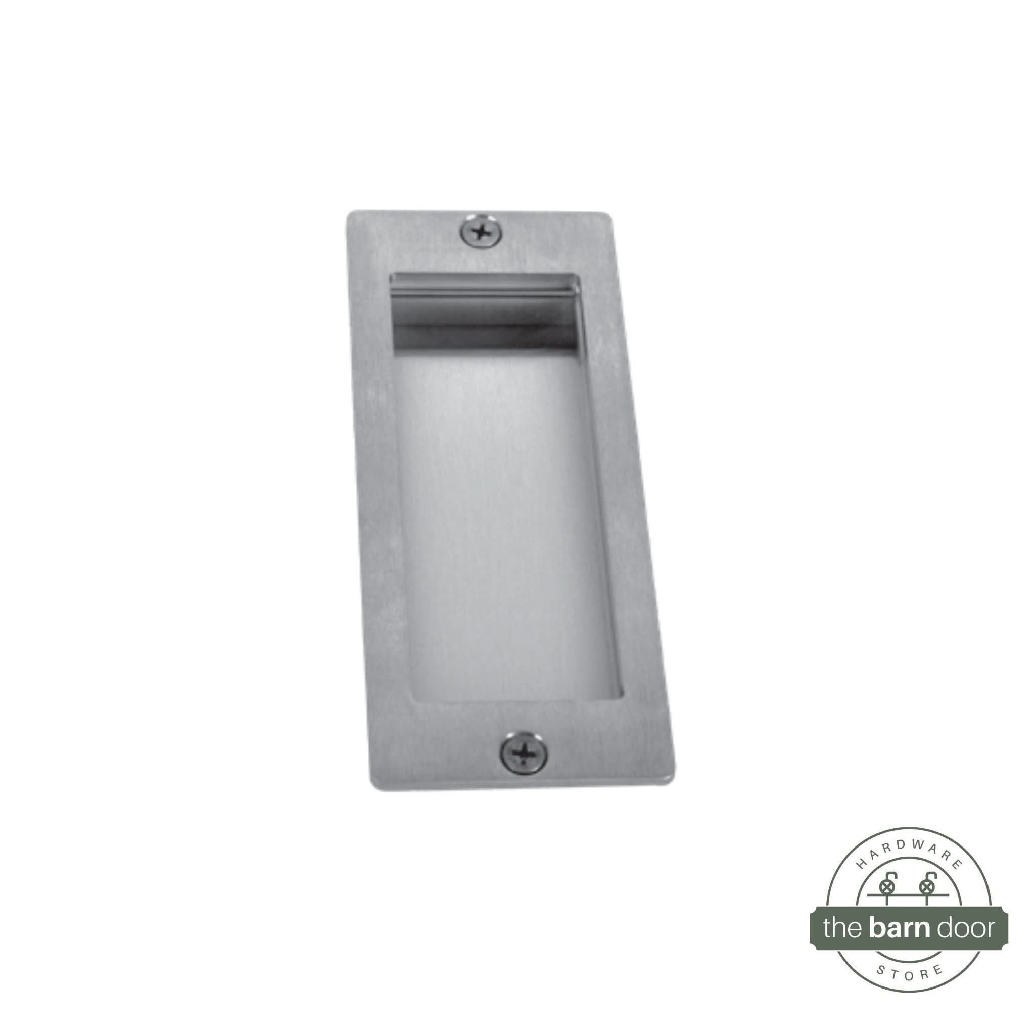 A close-up of a modern, rectangular flush pull handle with sharp, square corners, made from brushed stainless steel.
