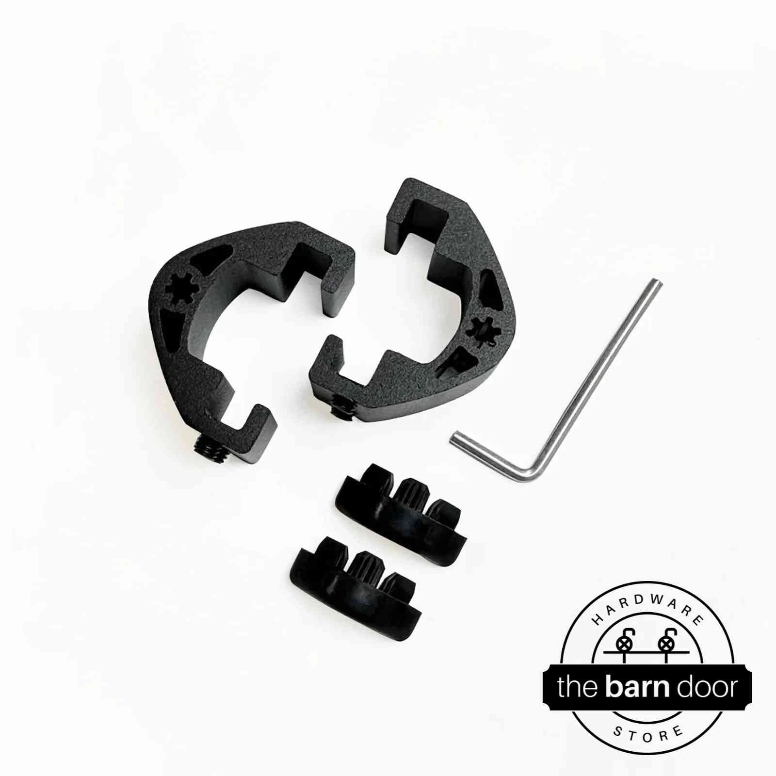 Adjustable barn door track stop components in matte black, including two C-shaped clamps, rubber bumpers, and an allen wrench. By The Barn Door Hardware Store.