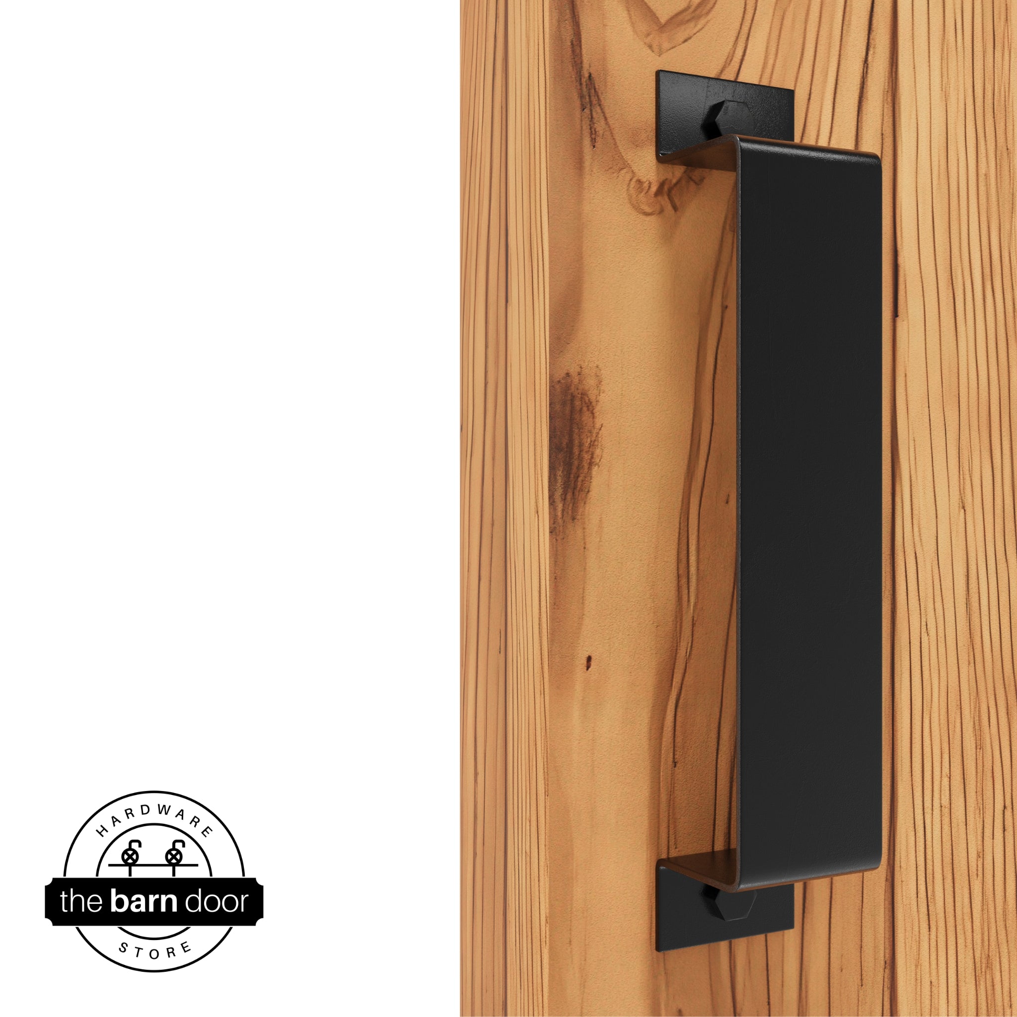 A black, arch-shaped barn door handle is mounted on a light-colored wooden door with a vertical grain pattern.