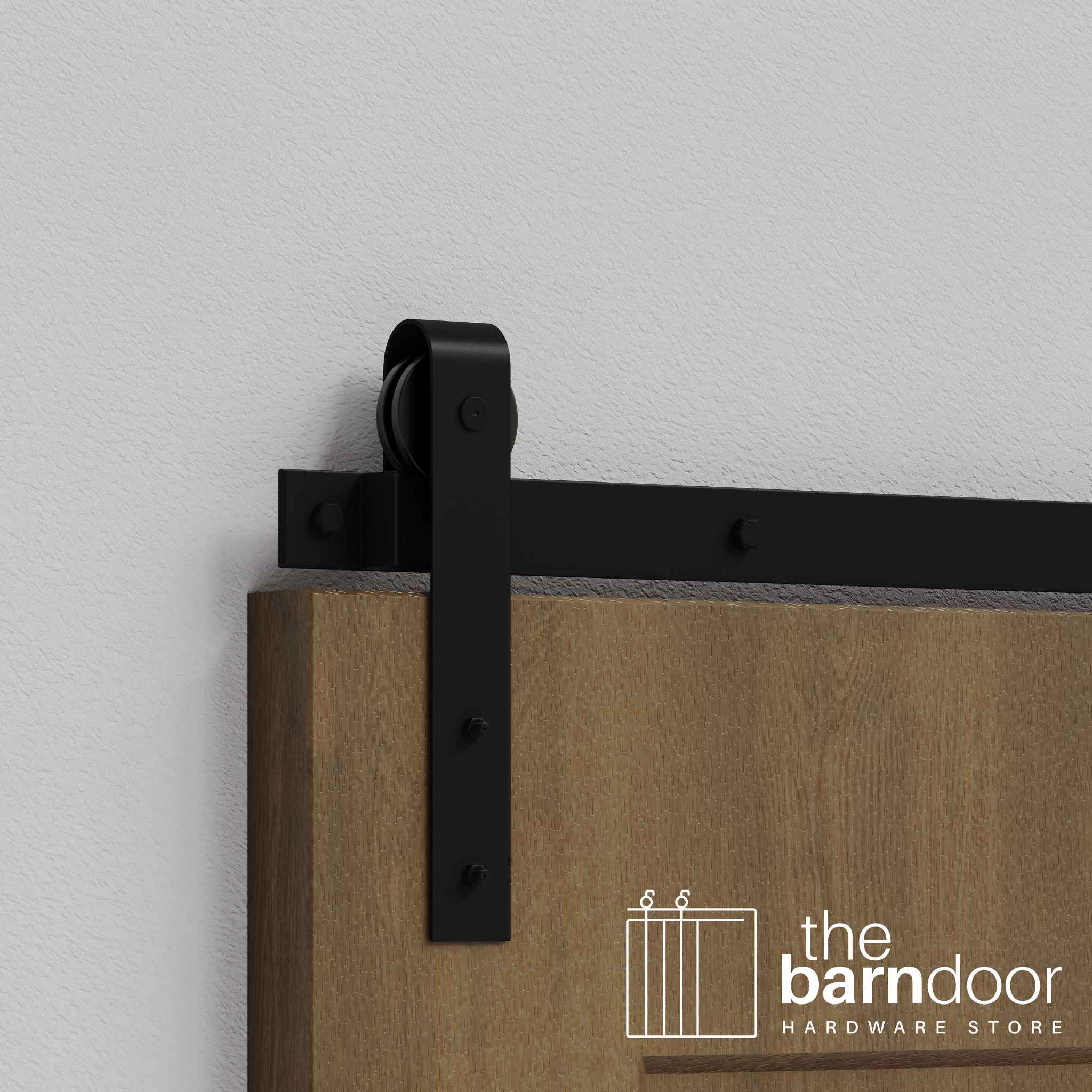 Close-up of Black J-Strap Single Track barn door hardware installed on a wooden door panel.