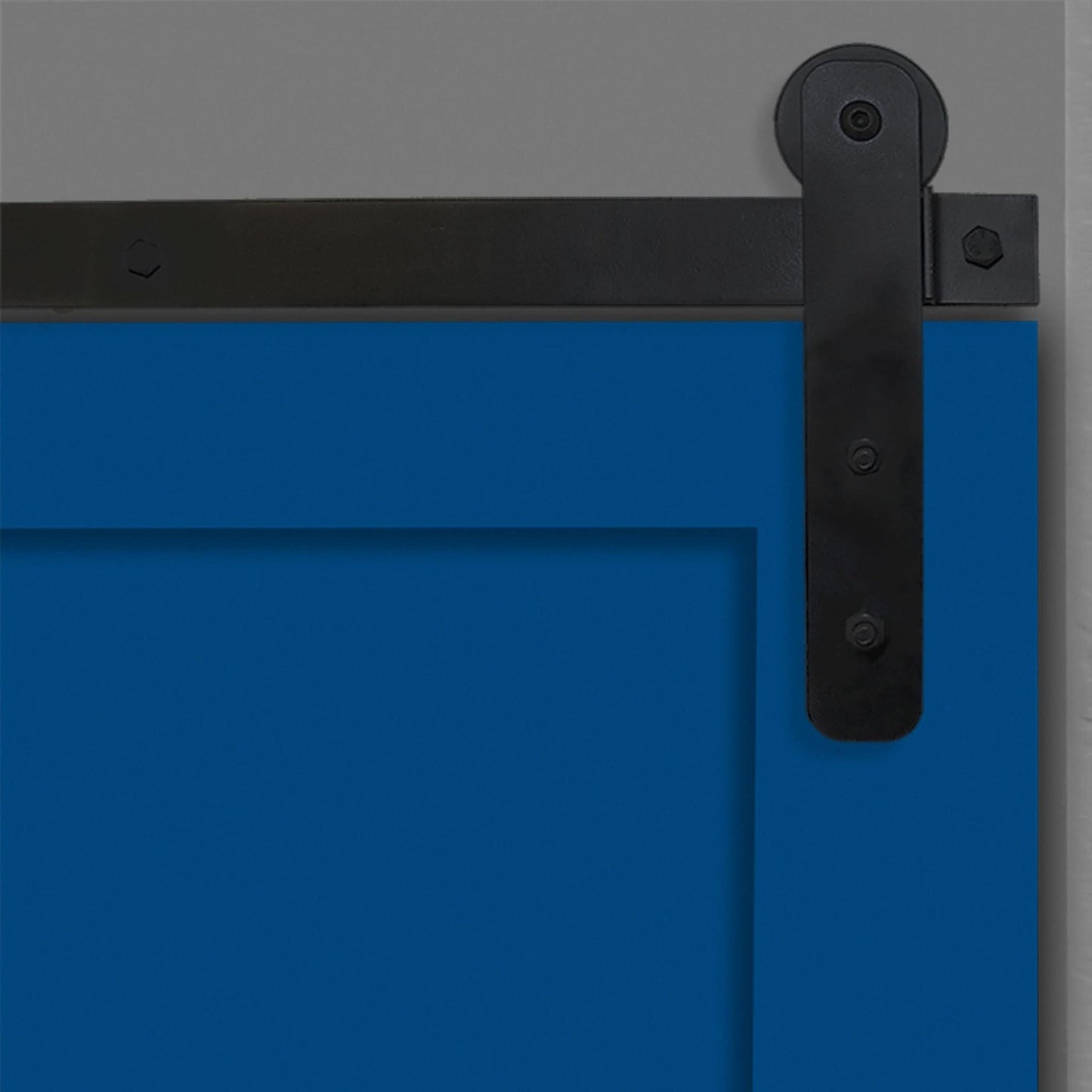 Close-up of Black Straight Strap Single Track barn door hardware installed on a blue door panel.