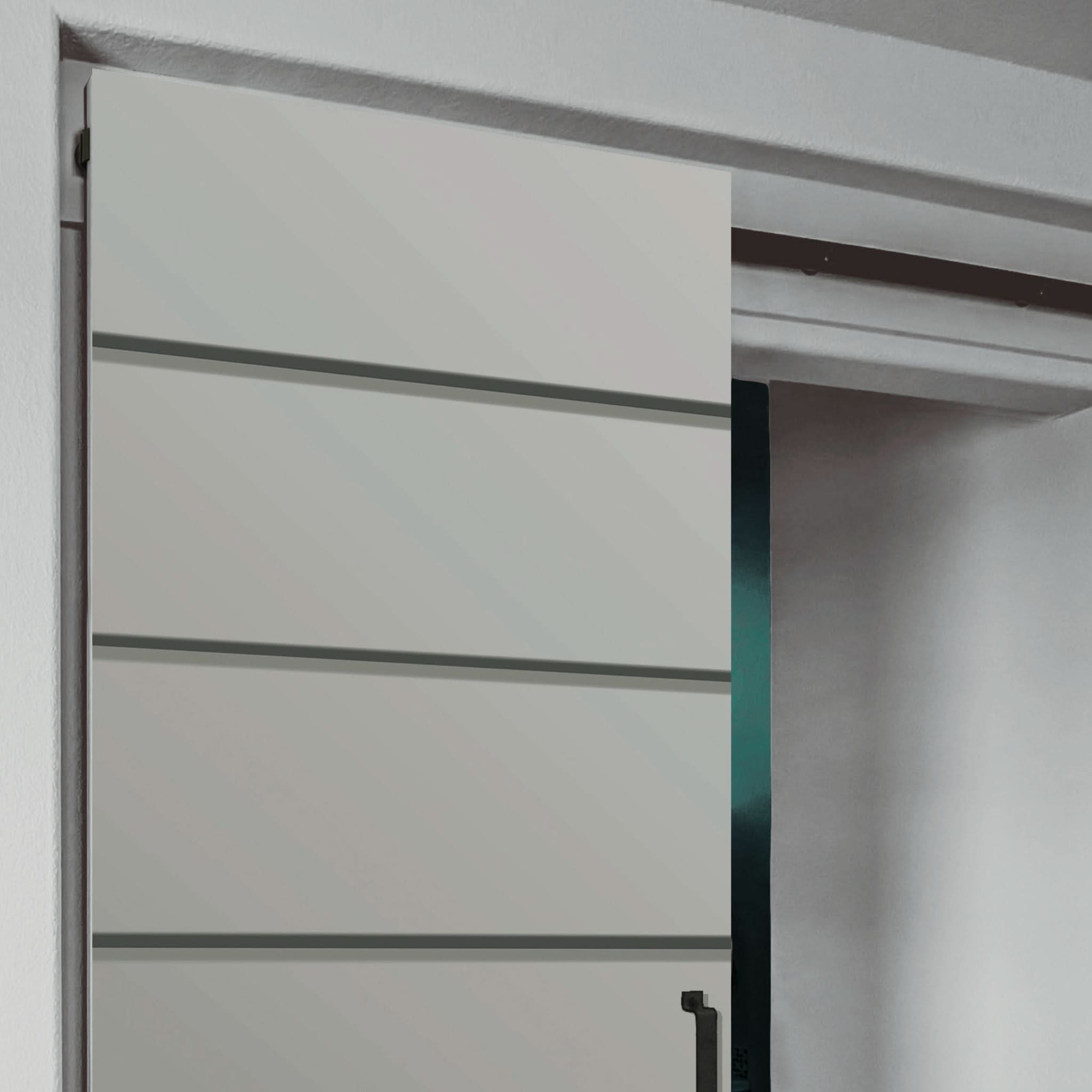 A view showing the concealed rollers and track, the mechanism behind our innovative invisible barn door hardware from Goldberg Brothers.