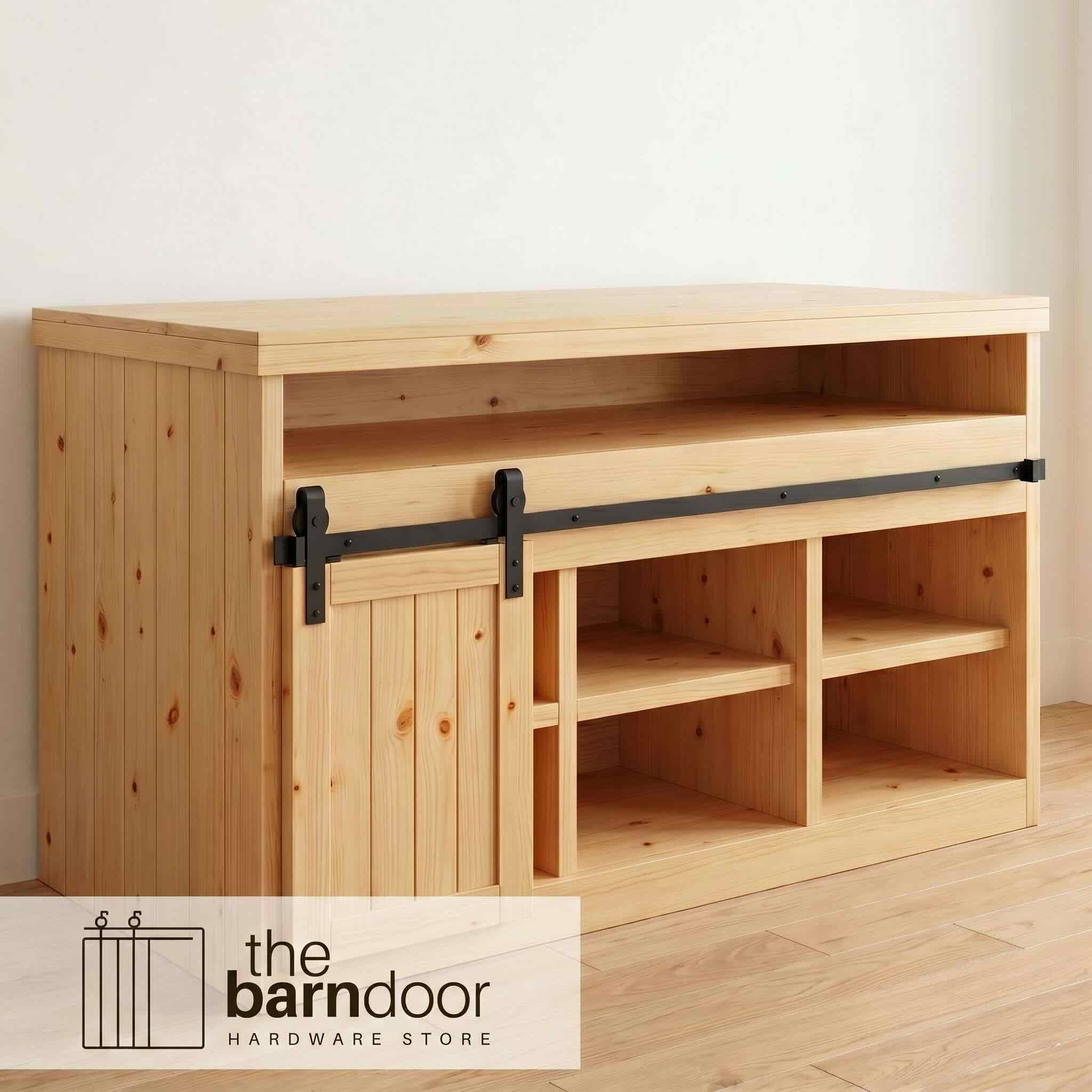 Classic J-Strap cabinet barn door hardware kit in a matte black finish, mounted on a small cabinet door.