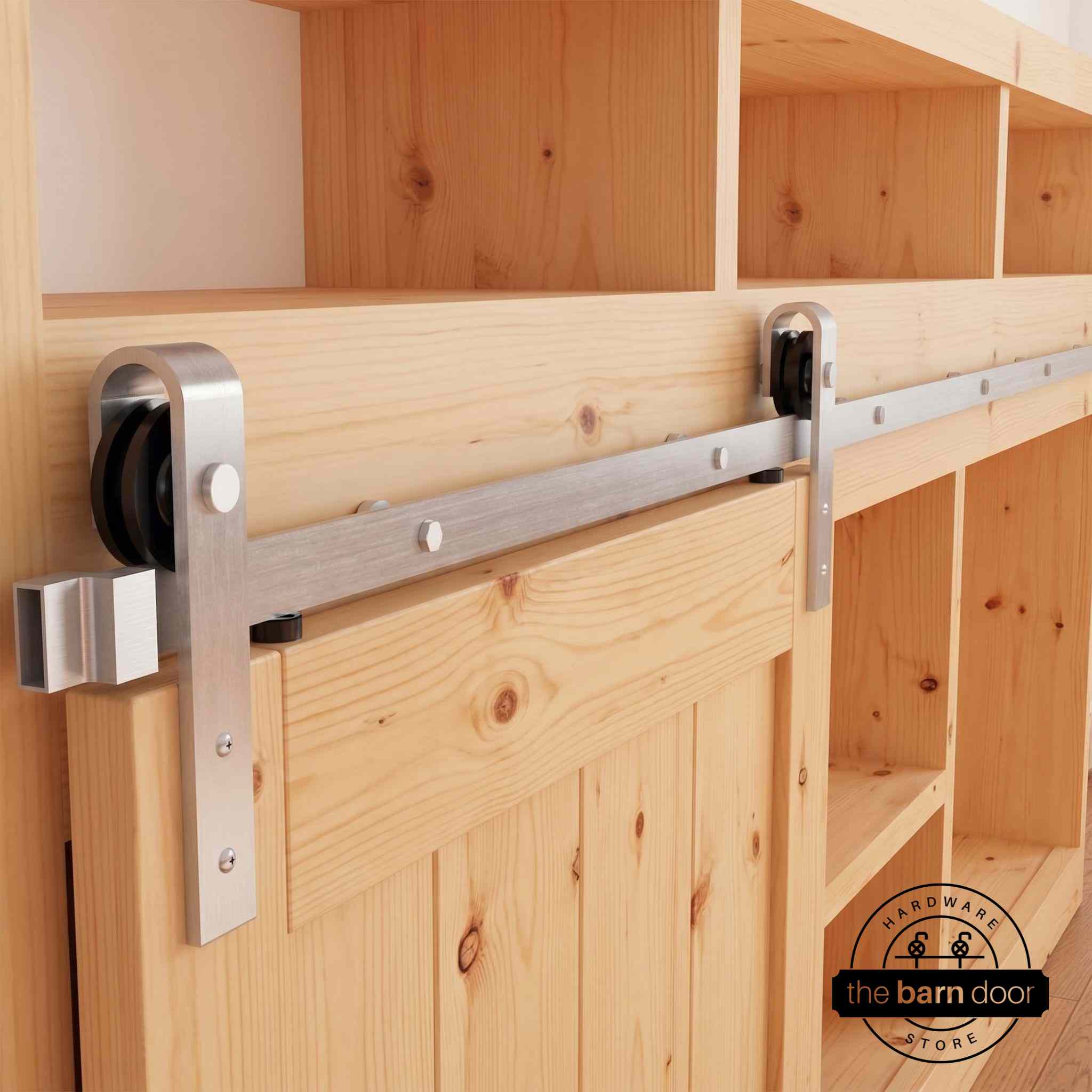 Classic J-Strap cabinet barn door hardware kit in a brushed nickel finish, mounted on a small cabinet door.