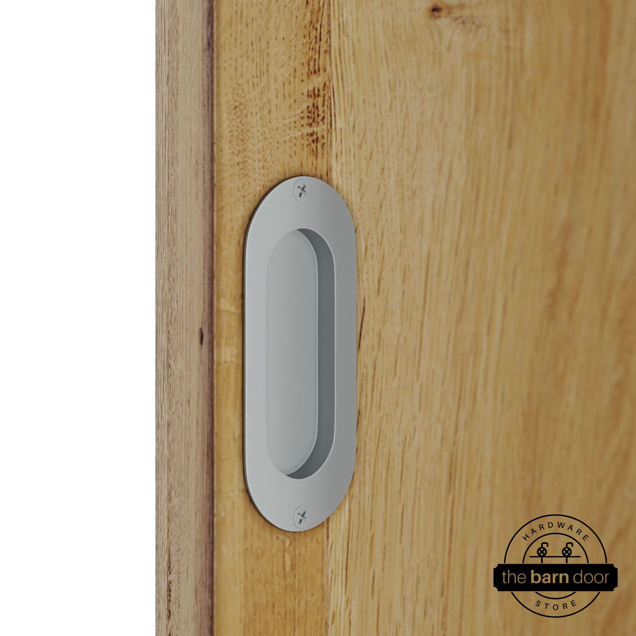 Wooden door with a silver metallic flush pull handle.