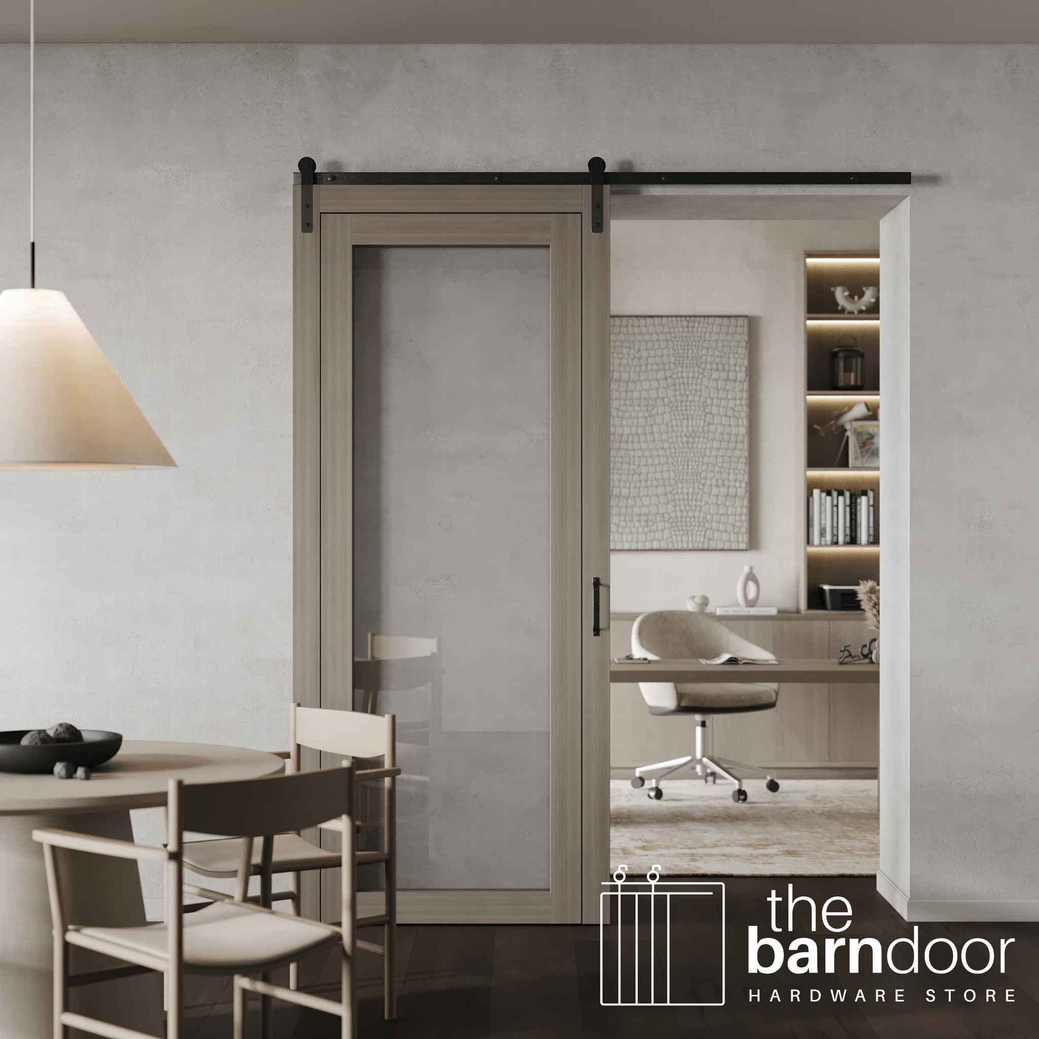 A contemporary glass-panel barn door with single track hardware installed, separating a dining area from a modern home office.