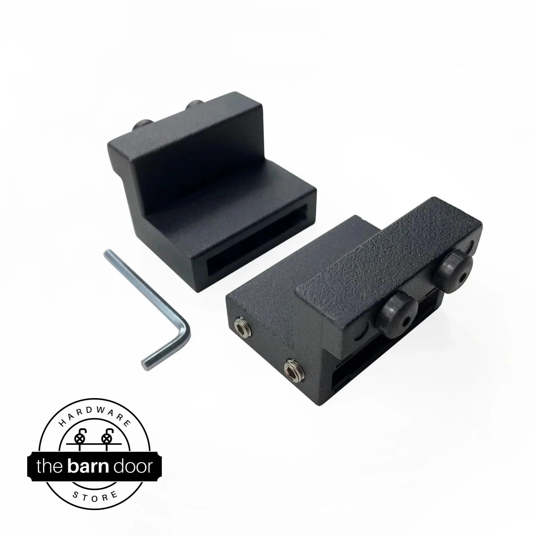 Stair-stepping barn door stopper set in matte black, including two rectangular stop blocks and an allen wrench. By The Barn Door Hardware Store.