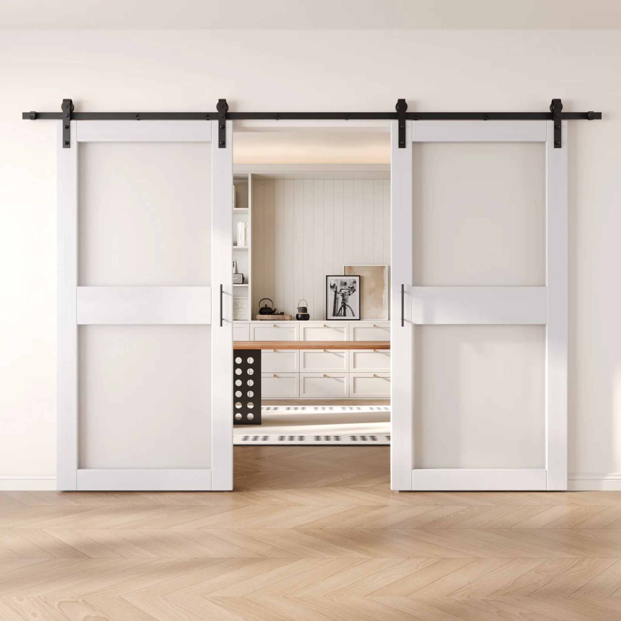 White wooden sliding glass panel barn doors with black hardware in a modern interior setting.