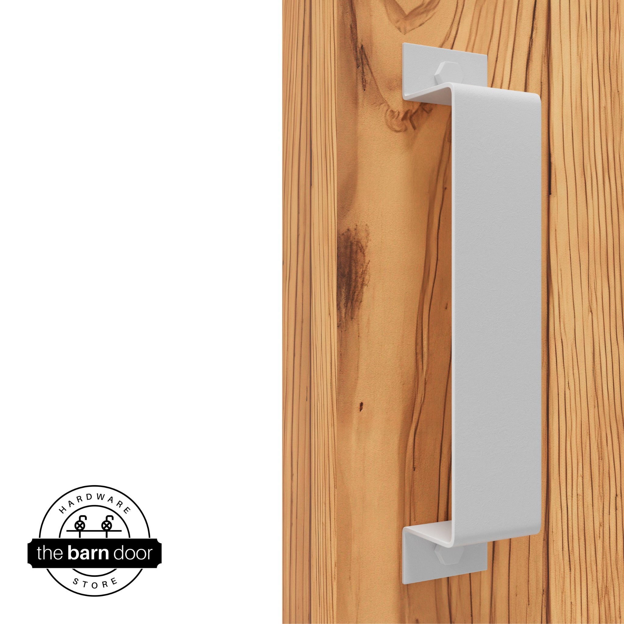 A white, arch-shaped barn door handle is mounted on a light-colored wooden door with a vertical grain pattern.