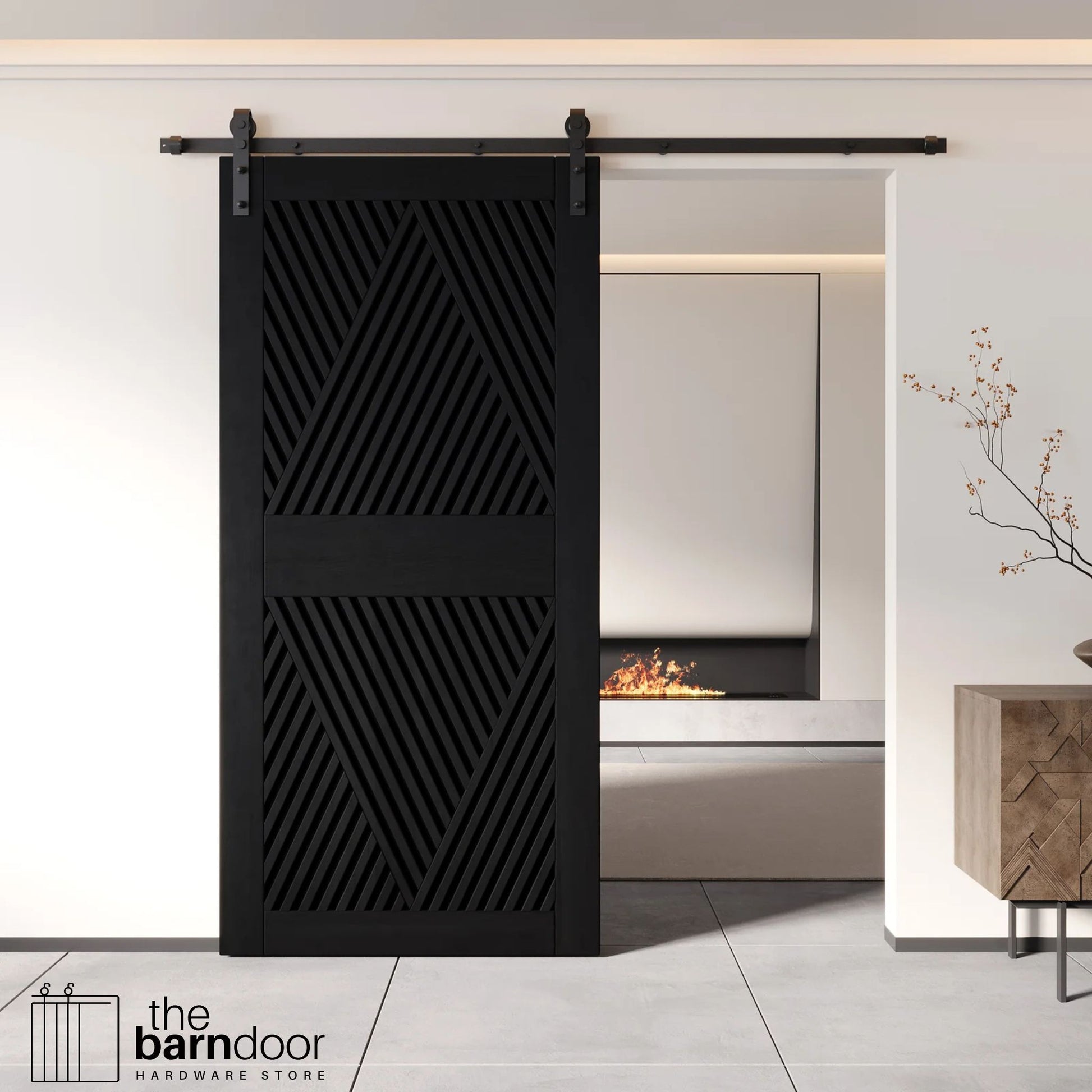 A modern black barn door with an intricate geometric diamond pattern installed on a black track in a contemporary living space with a fireplace.