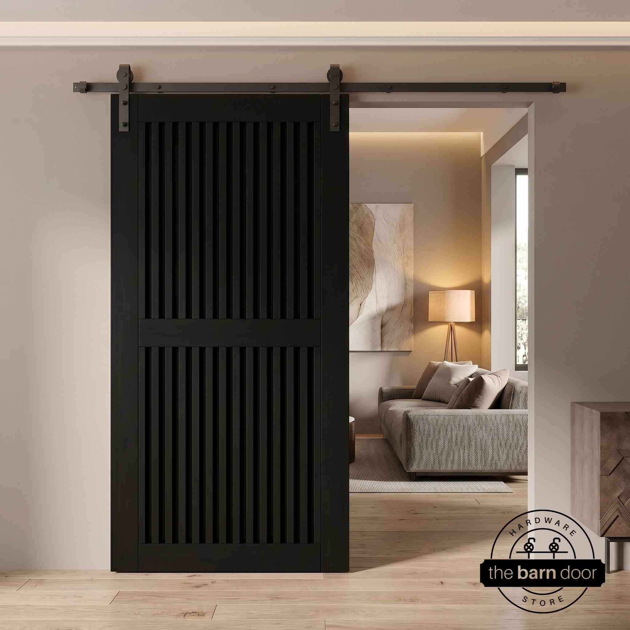 Black slatted sliding barn door in a modern interior setting with a fireplace.