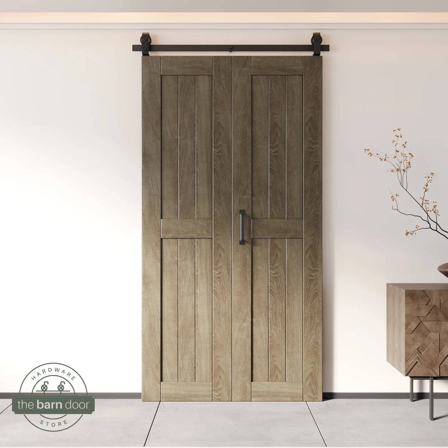 Two-panel bifold barn door in Classic Gray finish, installed and fully closed in a modern interior, showing the top-mount Matte Black track.