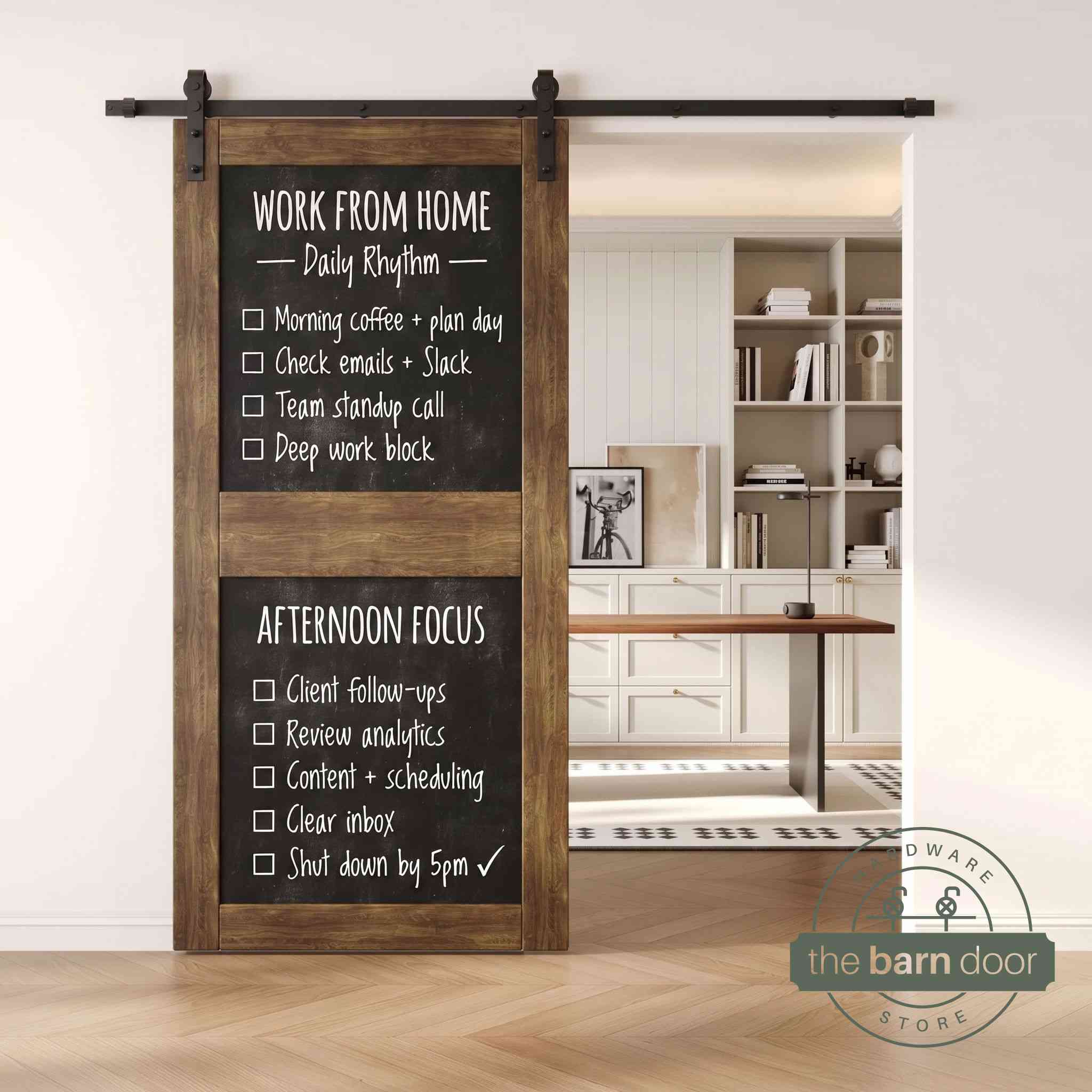 A dark walnut two-panel chalkboard barn door mounted on a sleek black sliding track, shown partially open to reveal a modern home office with built-in white shelving.