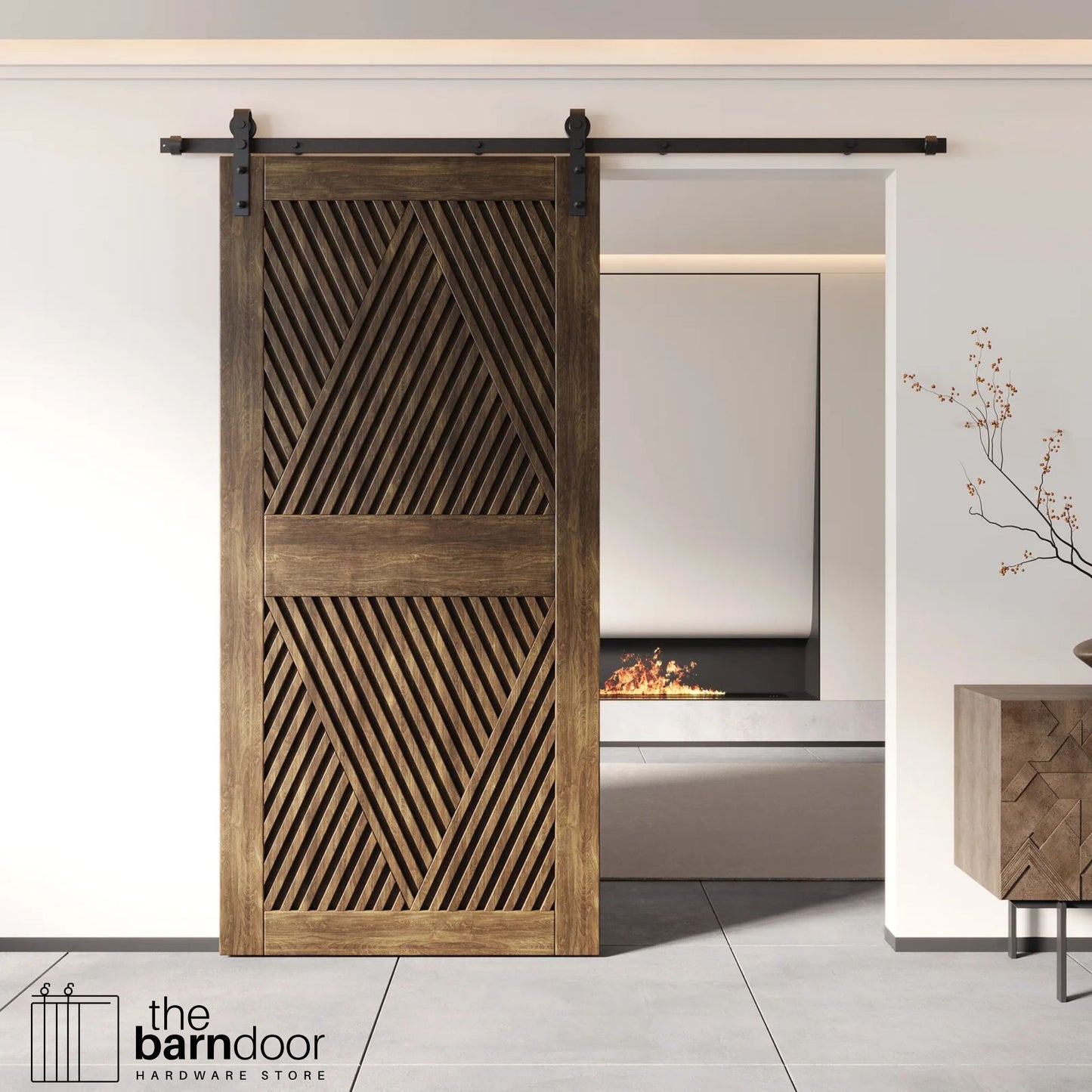 A modern dark walnut barn door with an intricate geometric diamond pattern installed on a black track in a contemporary living space with a fireplace.
