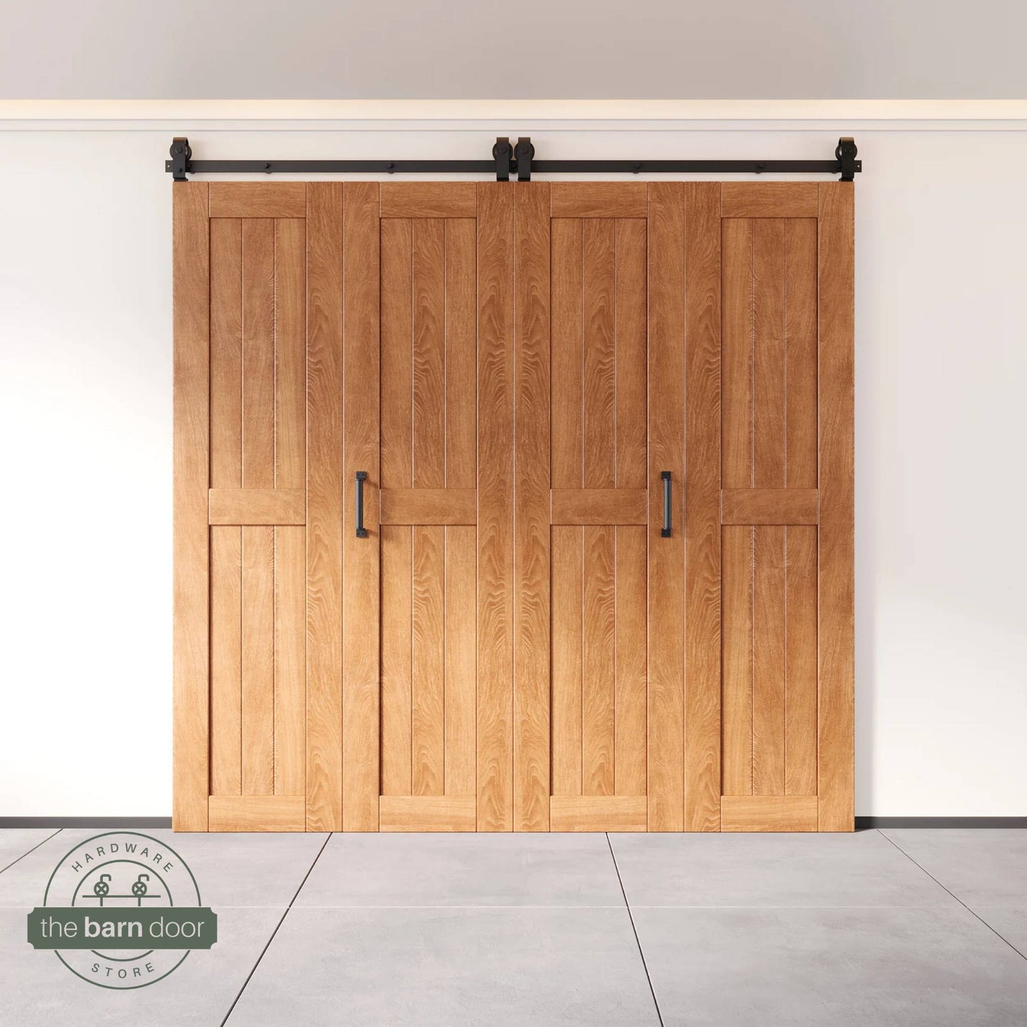 Four-panel bi-parting bifold barn door in an early American finish, fully closed in a modern entryway, showing the top-mount Matte Black track.