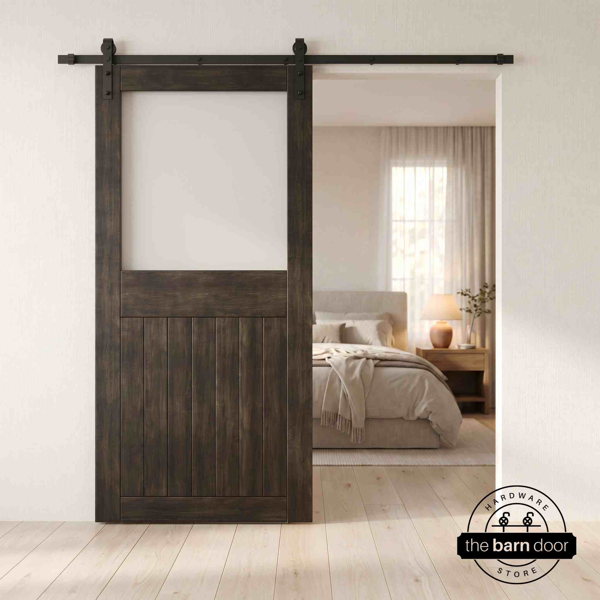 Ebony sliding half-lite frosted glass barn door in a modern interior setting with a desk and shelves.