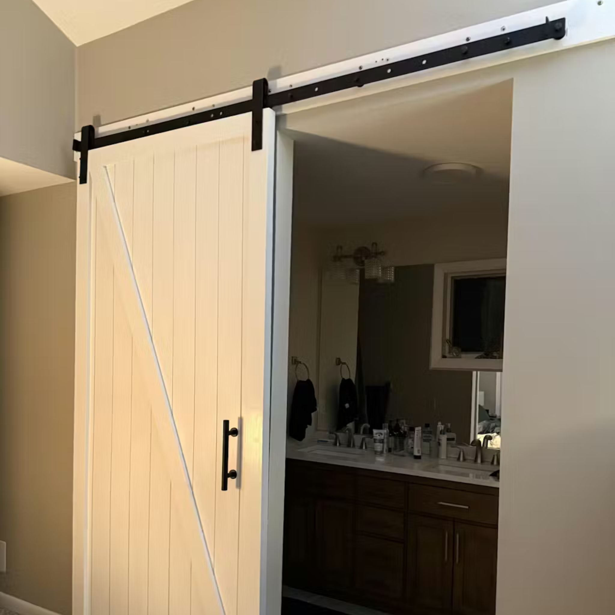 Bathroom with a sliding wooden door
