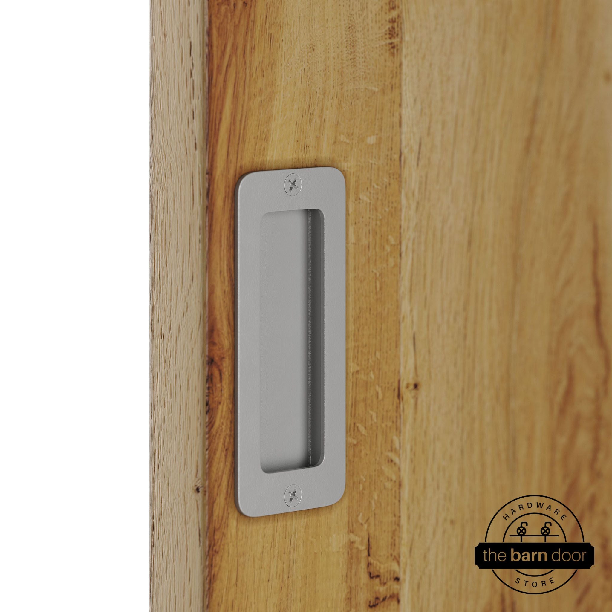 PC Chrome partial radius flush pull handle for sliding barn doors, installed on natural wood door panel