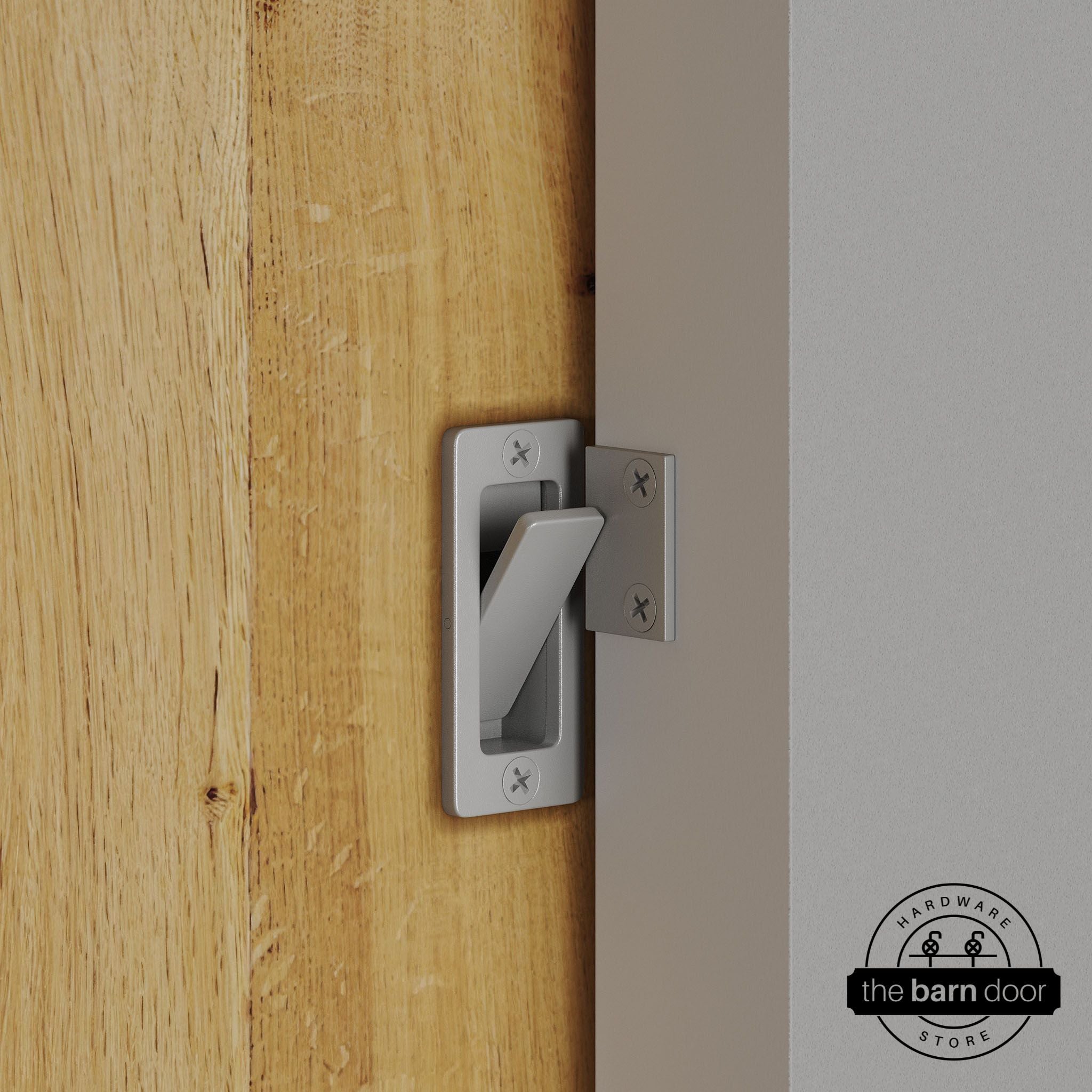 PC Chrome privacy latch installed on a sliding barn door, shown in the locked position against door frame