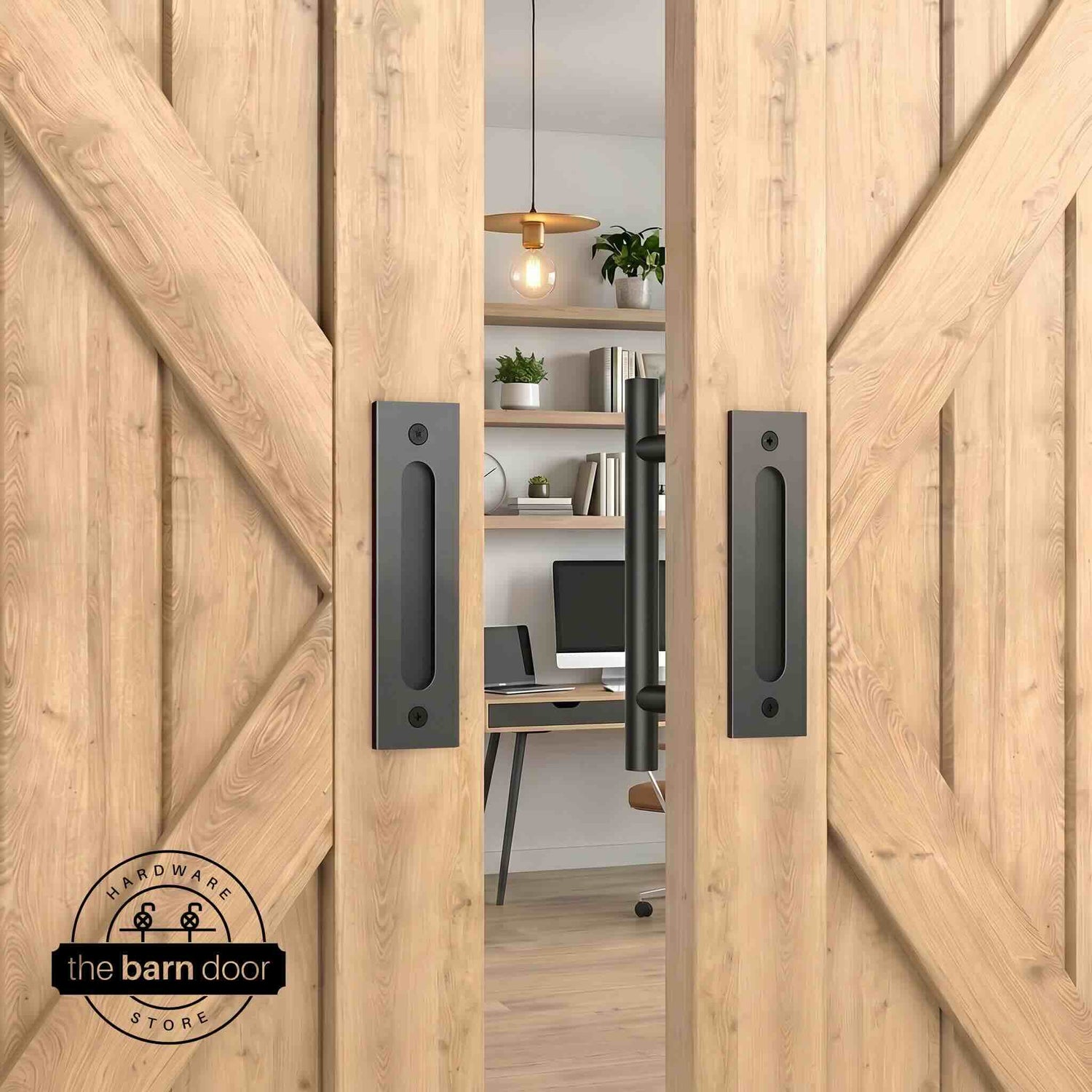 Matte black round pull and flush handle set installed on a white wood sliding barn door