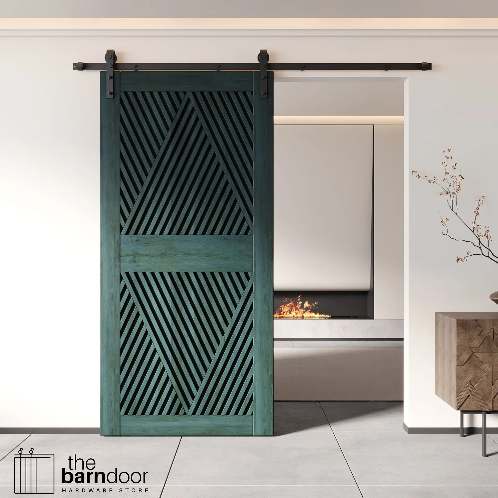 A modern royal pine barn door with an intricate geometric diamond pattern installed on a black track in a contemporary living space with a fireplace.