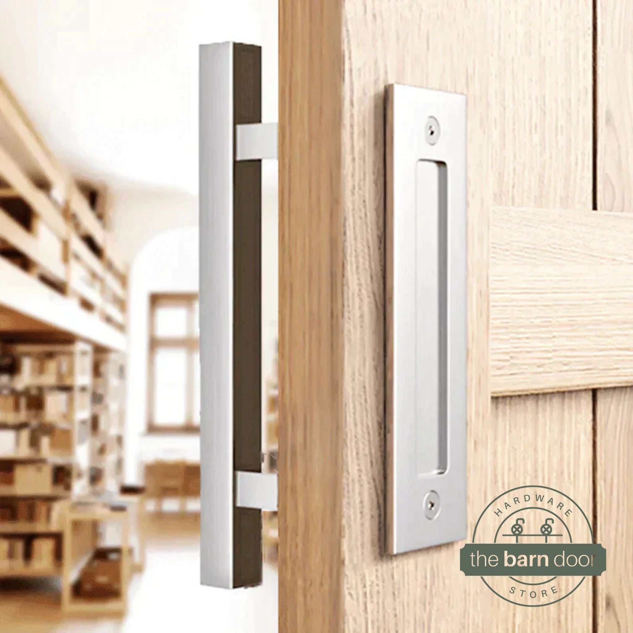 Stainless steel square pull and flush handle set installed on a natural wood sliding barn door