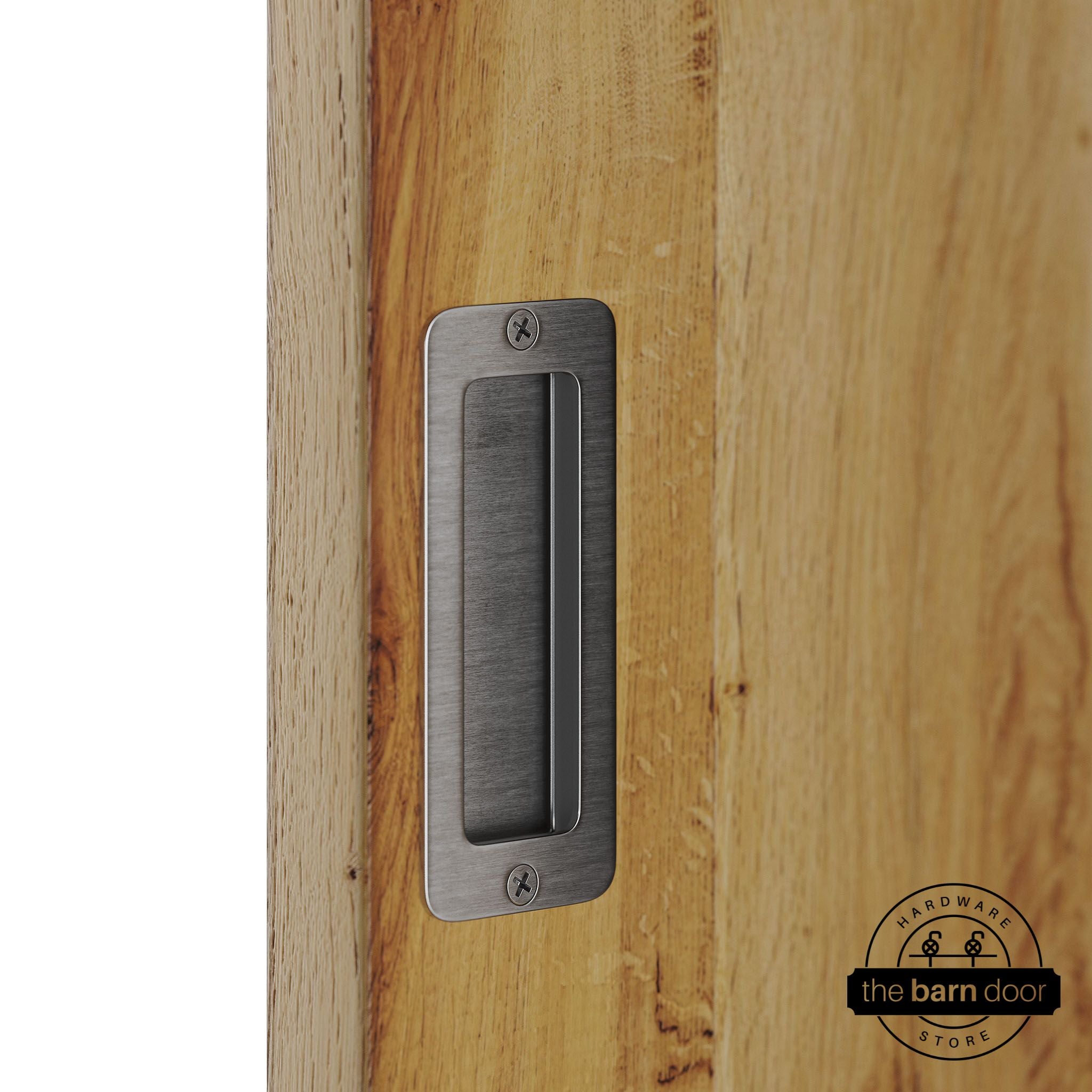 Stainless steel partial radius flush pull handle for sliding barn doors, installed on natural wood door panel