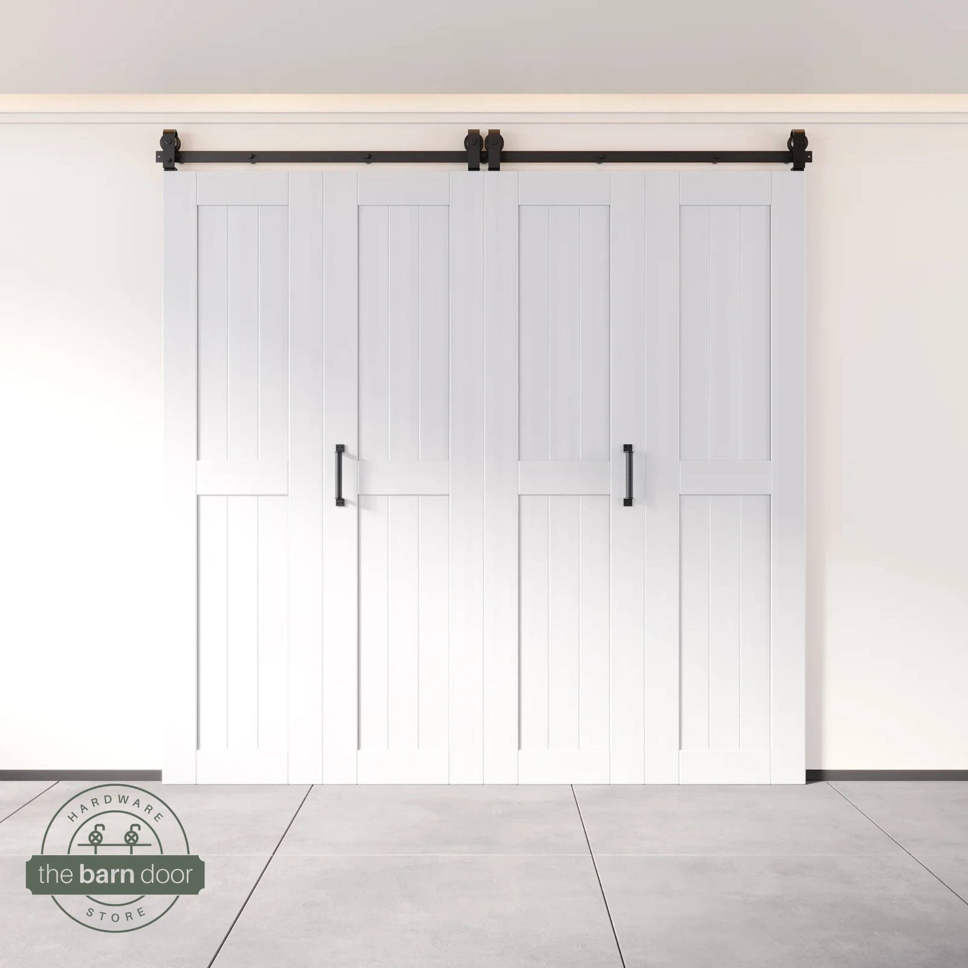 Four-panel bi-parting bifold barn door in a white finish, fully closed in a modern entryway, showing the top-mount Matte Black track.