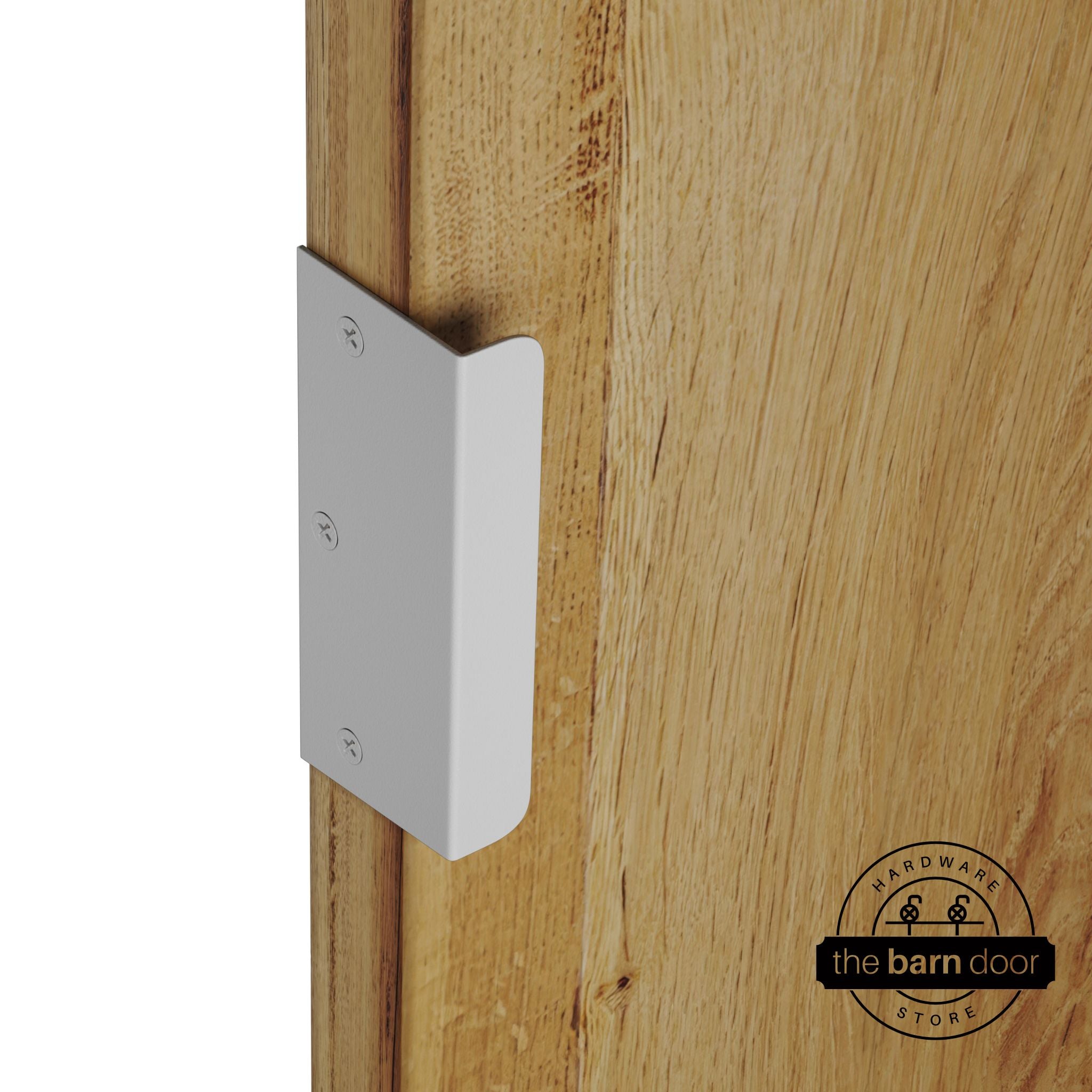 White sliding barn door edge pull handle on natural wood door edge