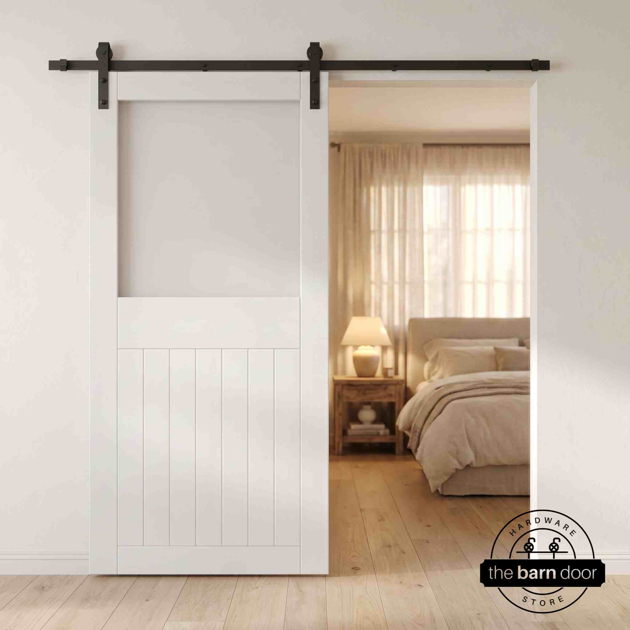 White sliding half-lite frosted glass barn door in a modern interior setting with a desk and shelves.