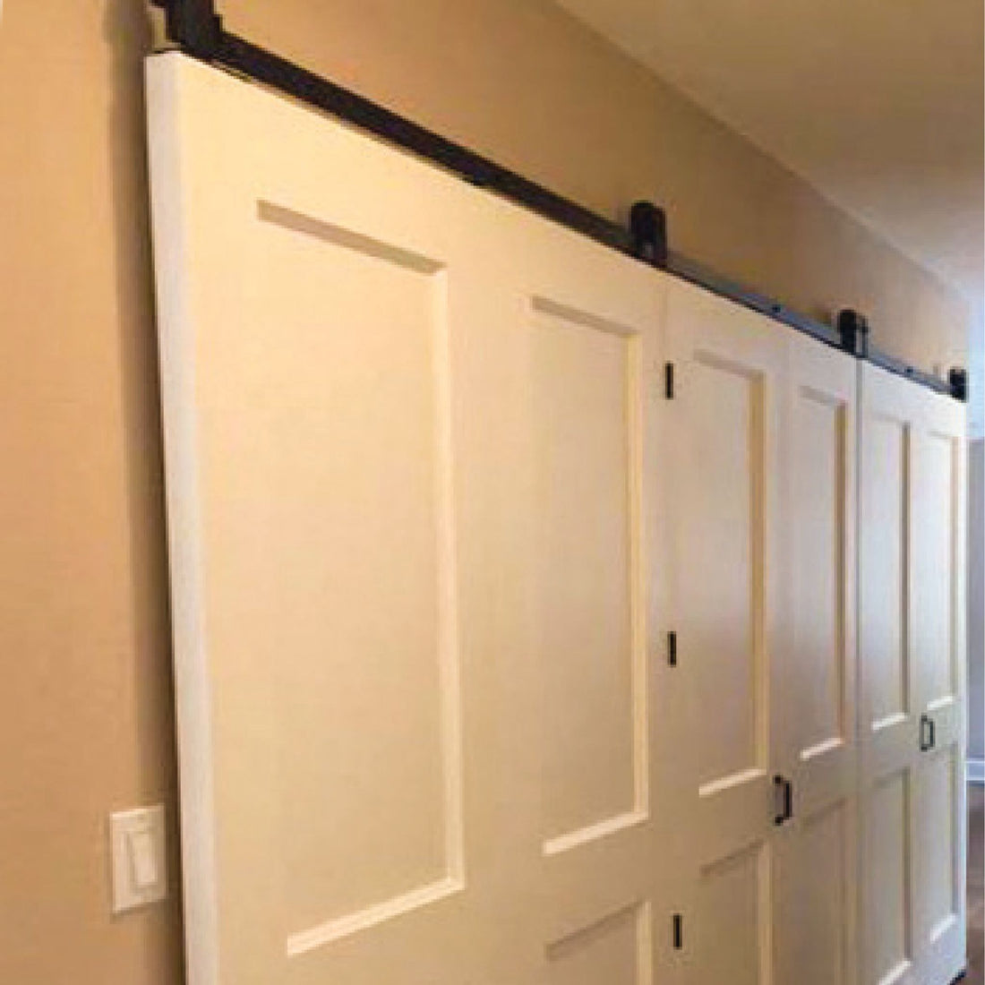 Bifold Barn Door Hardware Kit in a Hallway