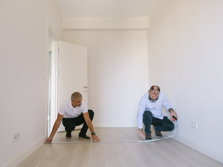 Two Contractors Measuring for a Barn Door