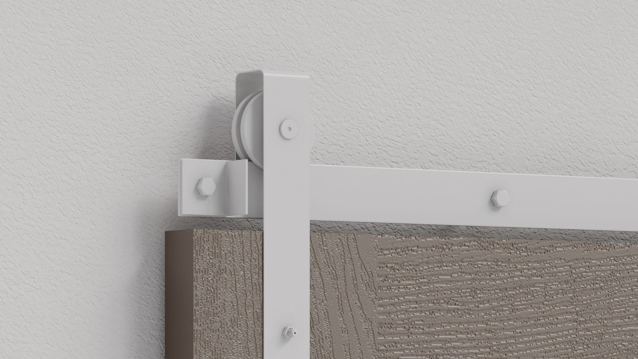 Close-up of modern, white front mount barn door hardware track and roller mechanism installed on a gray-brown textured wood door panel against a white textured wall.