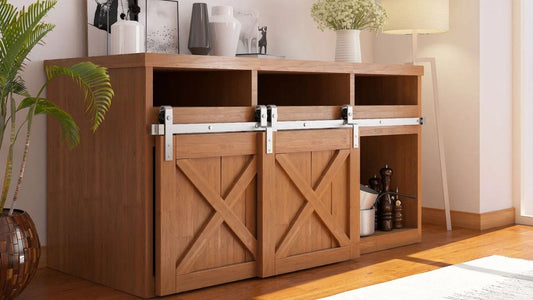 A modern wooden media console with two small, light brown barn doors and silver mini barn door hardware.