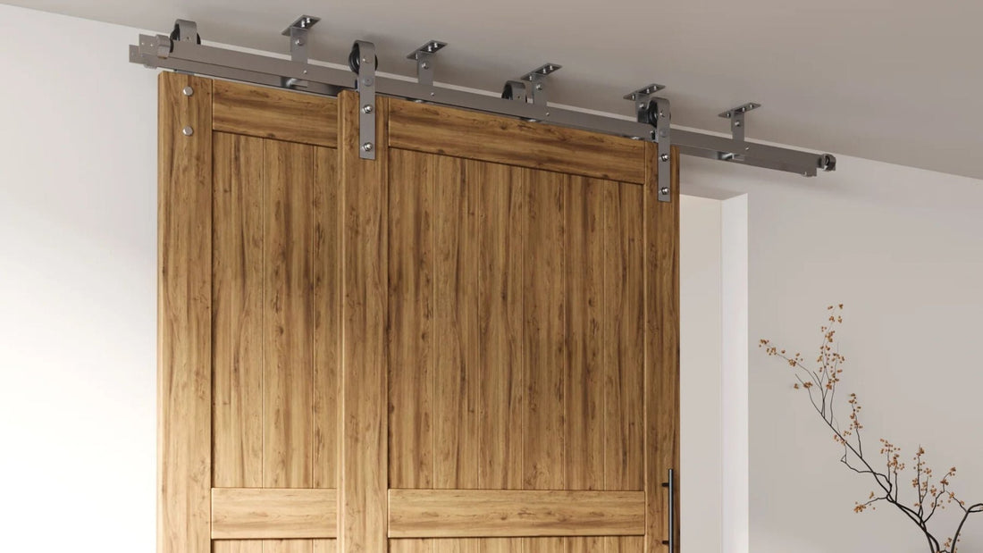 Double barn door system with natural wood panels installed using ceiling mount hardware, showing the track and brackets attached directly to the ceiling.