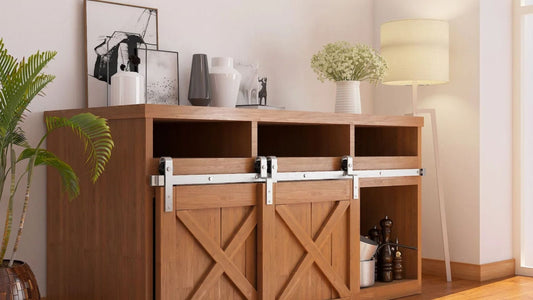 A close-up of a wood cupboard or console cabinet featuring two small doors with an X-brace design, installed using silver mini barn door sliding hardware.