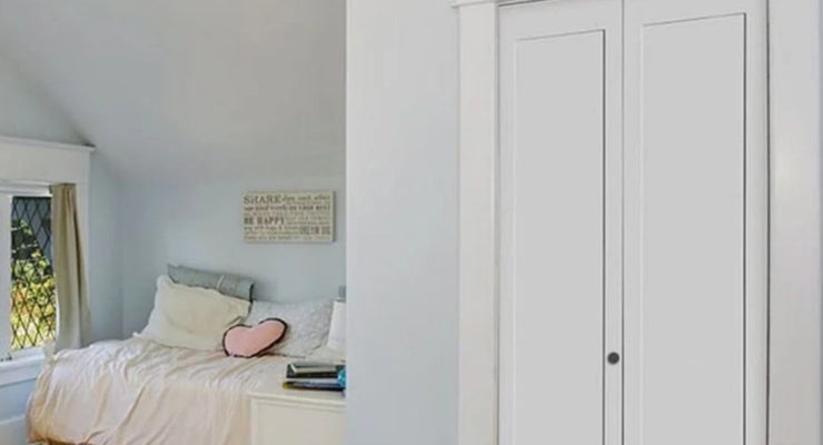 Bifold barn doors in a girl's bedroom leading to her closet.