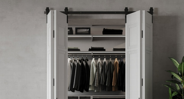 White barn doors leading to a closet, showcasing the clean aesthetic of 4 door bipating bifold barn door hardware.
