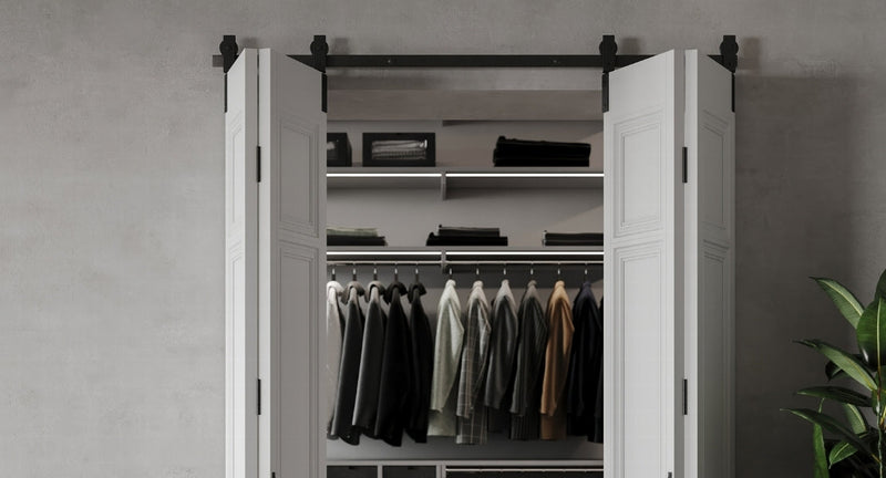 White barn doors leading to a closet, showcasing the clean aesthetic of 4 door bipating bifold barn door hardware.
