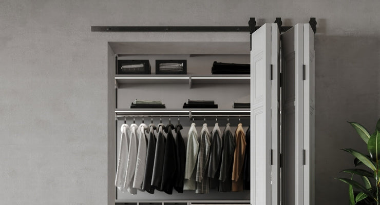 White barn doors leading to a closet, showcasing the clean aesthetic of 4 door one way bifold barn door hardware.