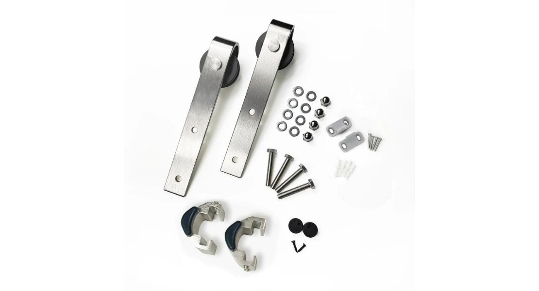 A close up of J-Strap barn door rollers and attaching hardware in brushed nickel.