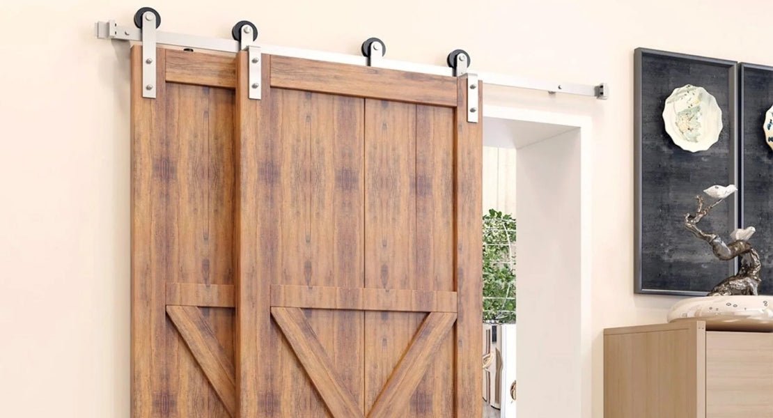 A modern single bypass barn door hardware system in brushed steel, with specially designed hangers that allow two dark wood doors to overlap on just one track.