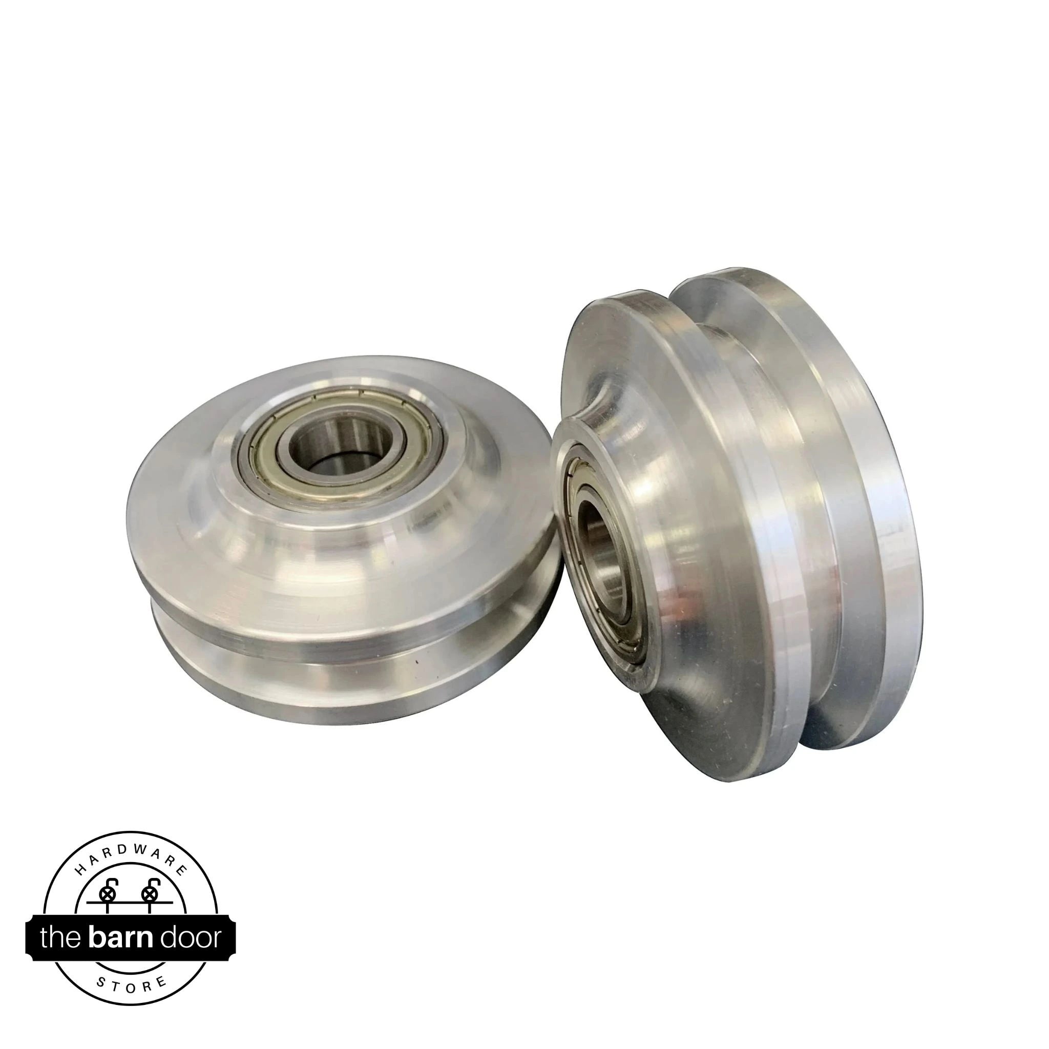 Set of two metal wheel rollers for barn door hardware.
