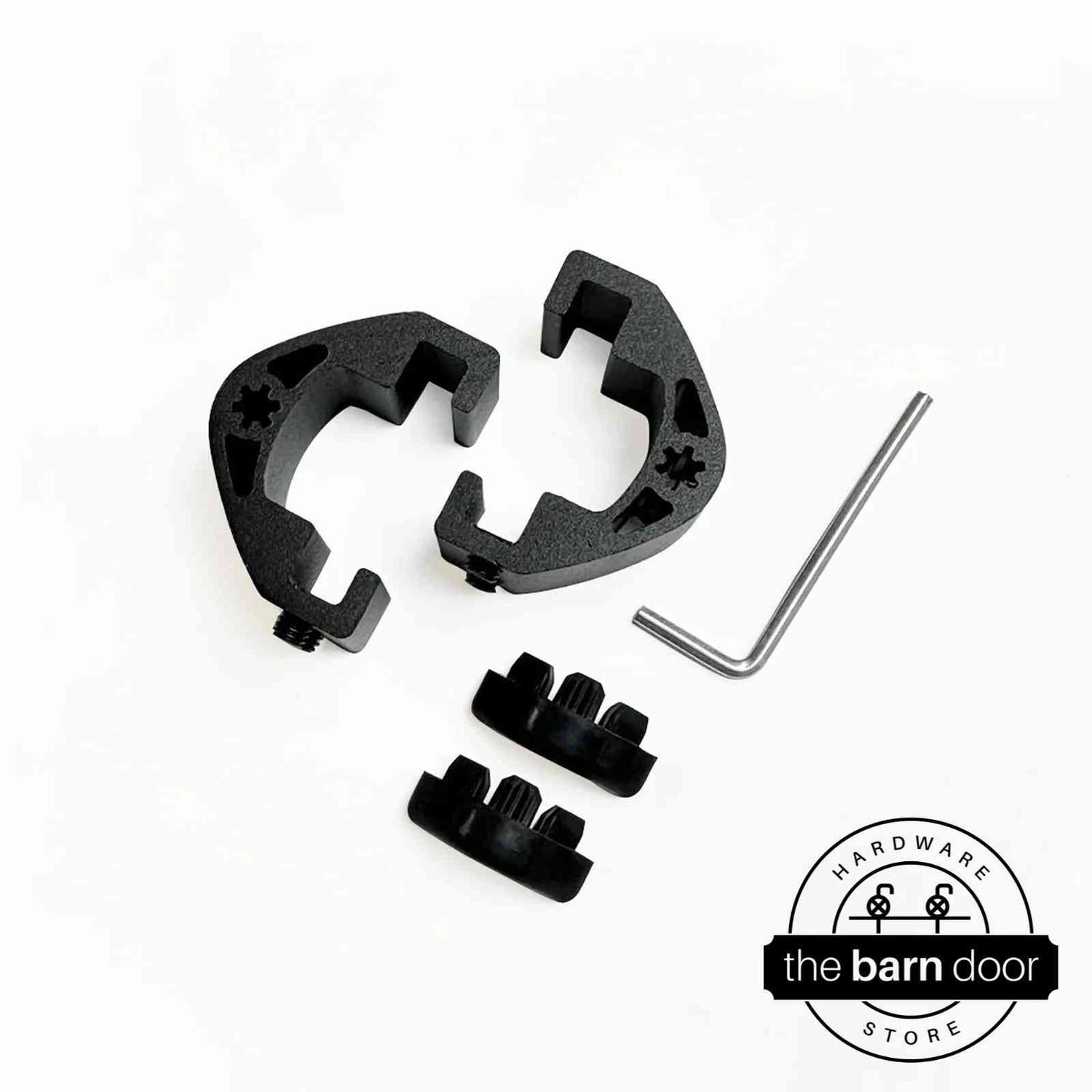 Adjustable barn door track stop components in matte black, including two C-shaped clamps, rubber bumpers, and an allen wrench. By The Barn Door Hardware Store.