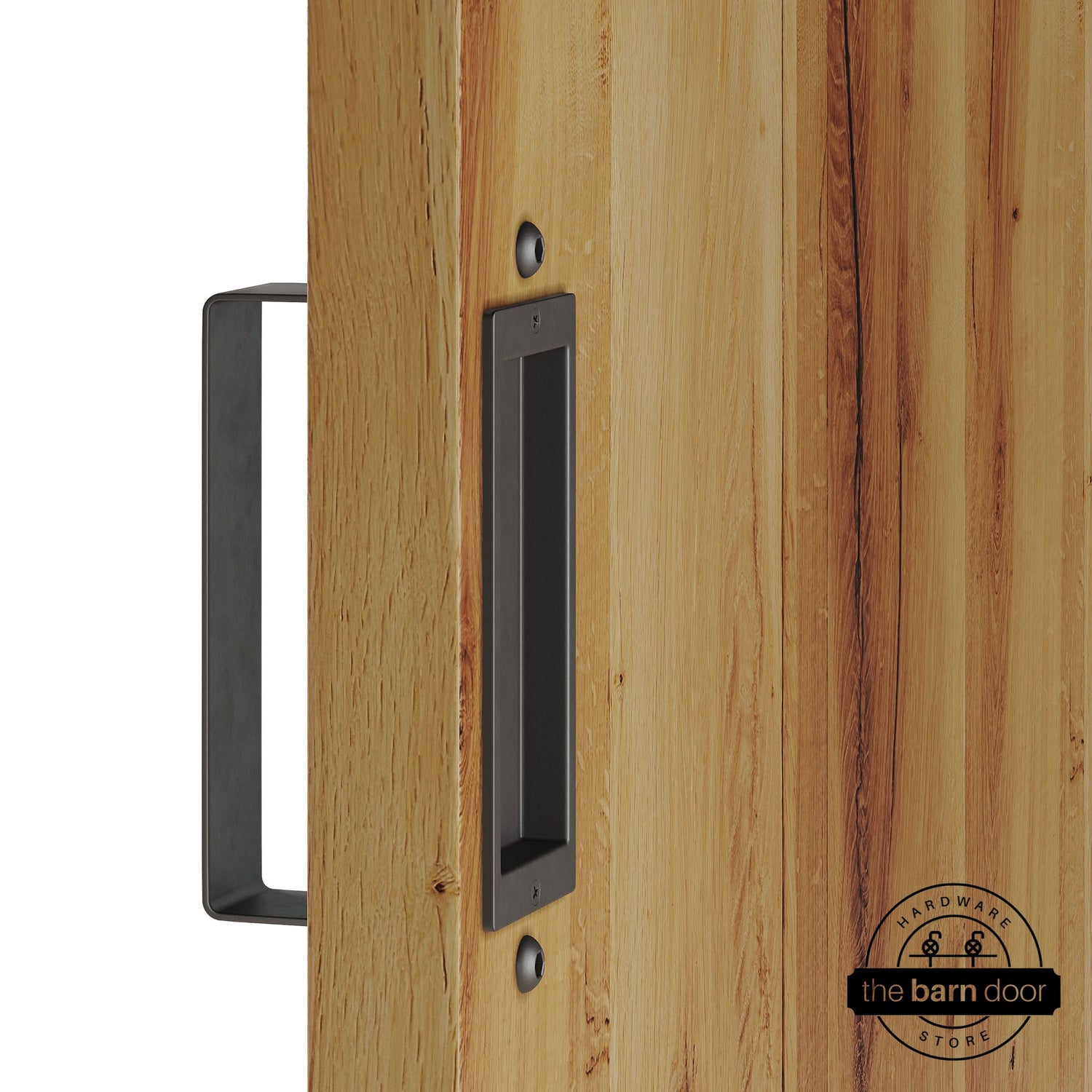 Arch bronze barn door pull handle set installed on a natural wood sliding door, featuring a rectangular U-shaped pull handle on the front face and a flush recessed pull plate on the reverse side, shown in a arch bronze finish.