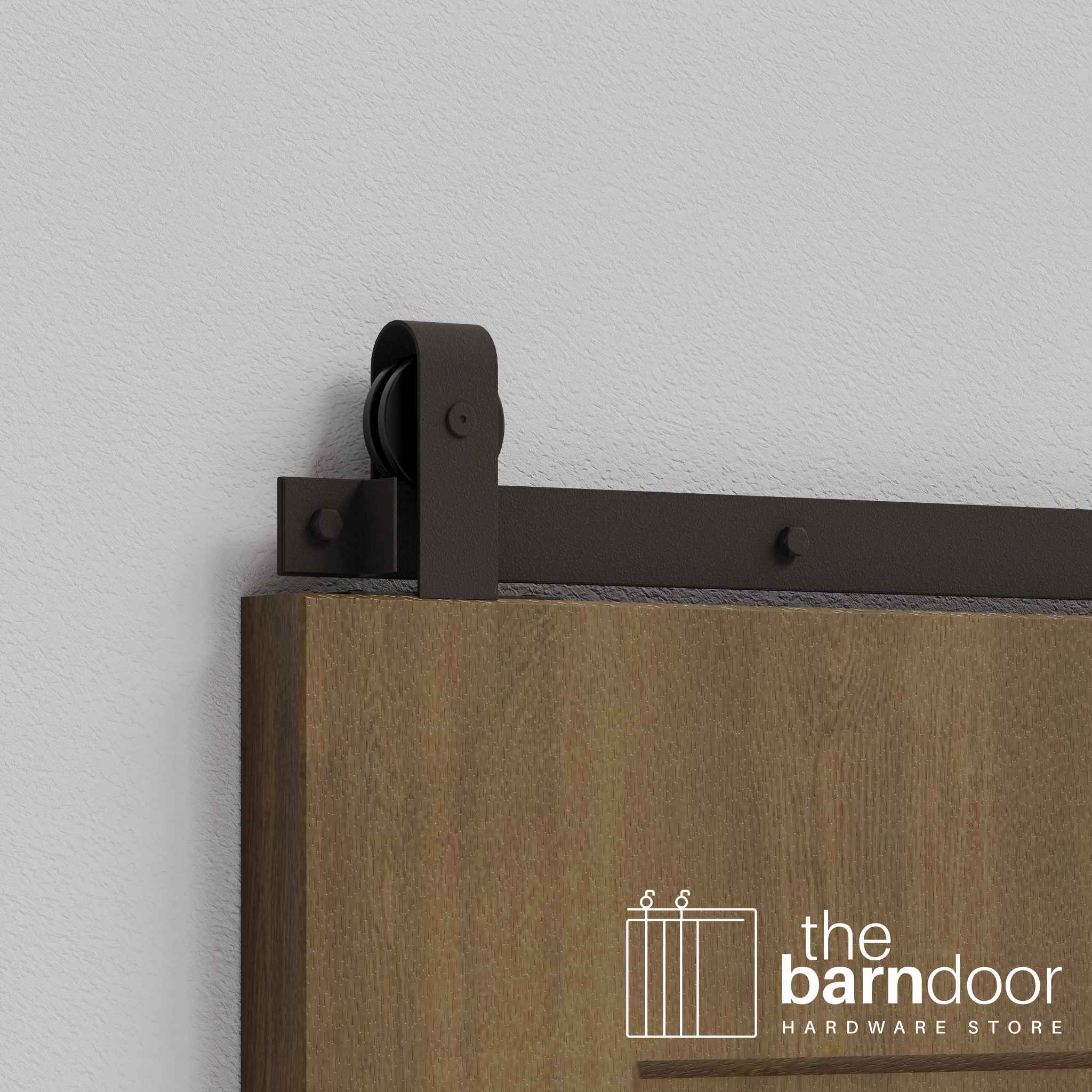 Close-up of Arch Bronze J Top Mount Single Track barn door hardware installed on a wooden door panel.