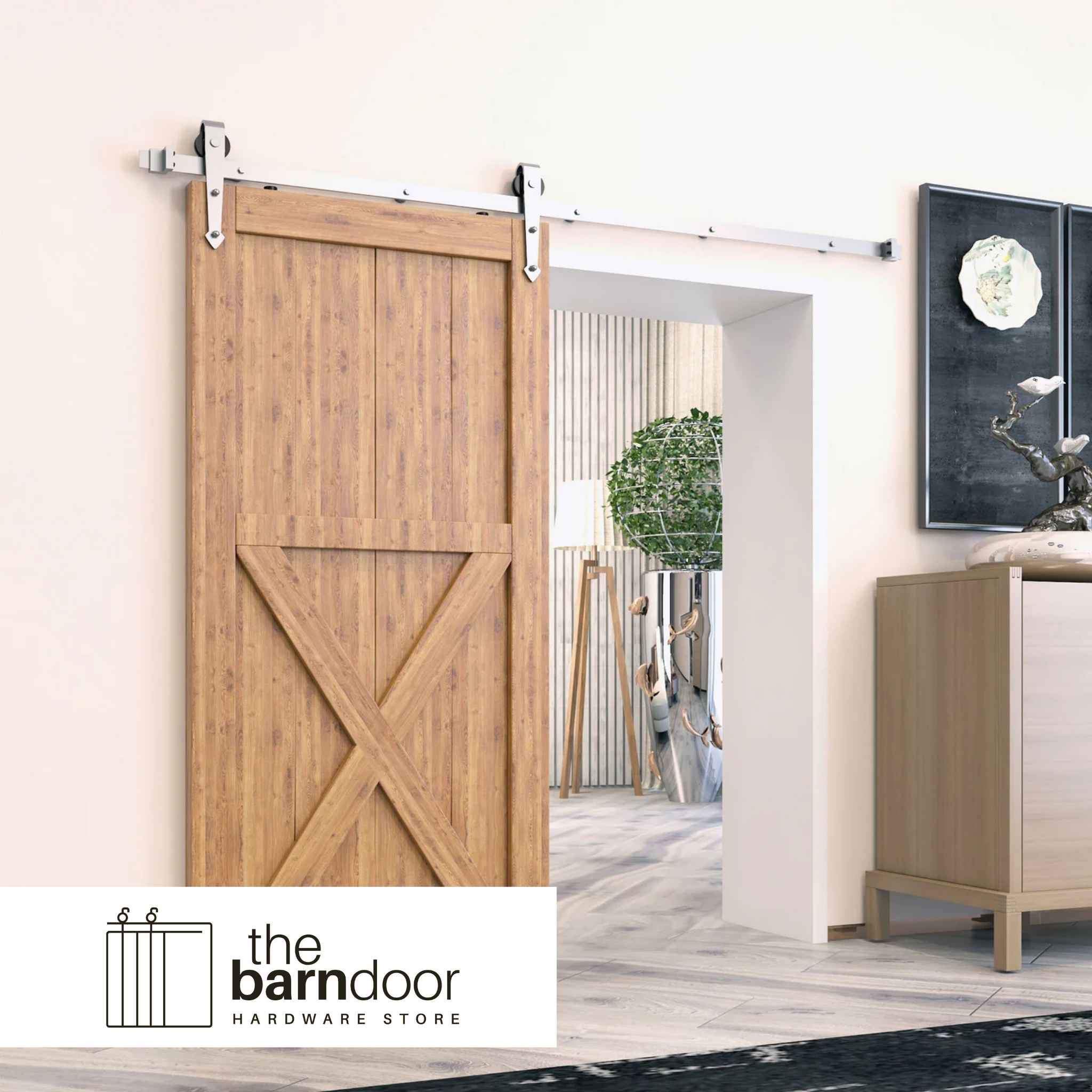 A half X barn door hung with brushed nickel sliding barn door hardware with arrow design rollers.