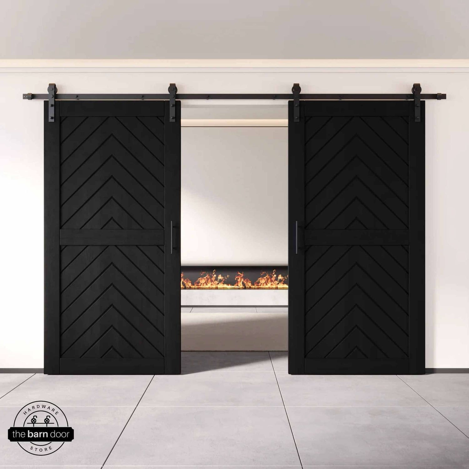 Black wooden barn doors with a chevron pattern on a white wall background