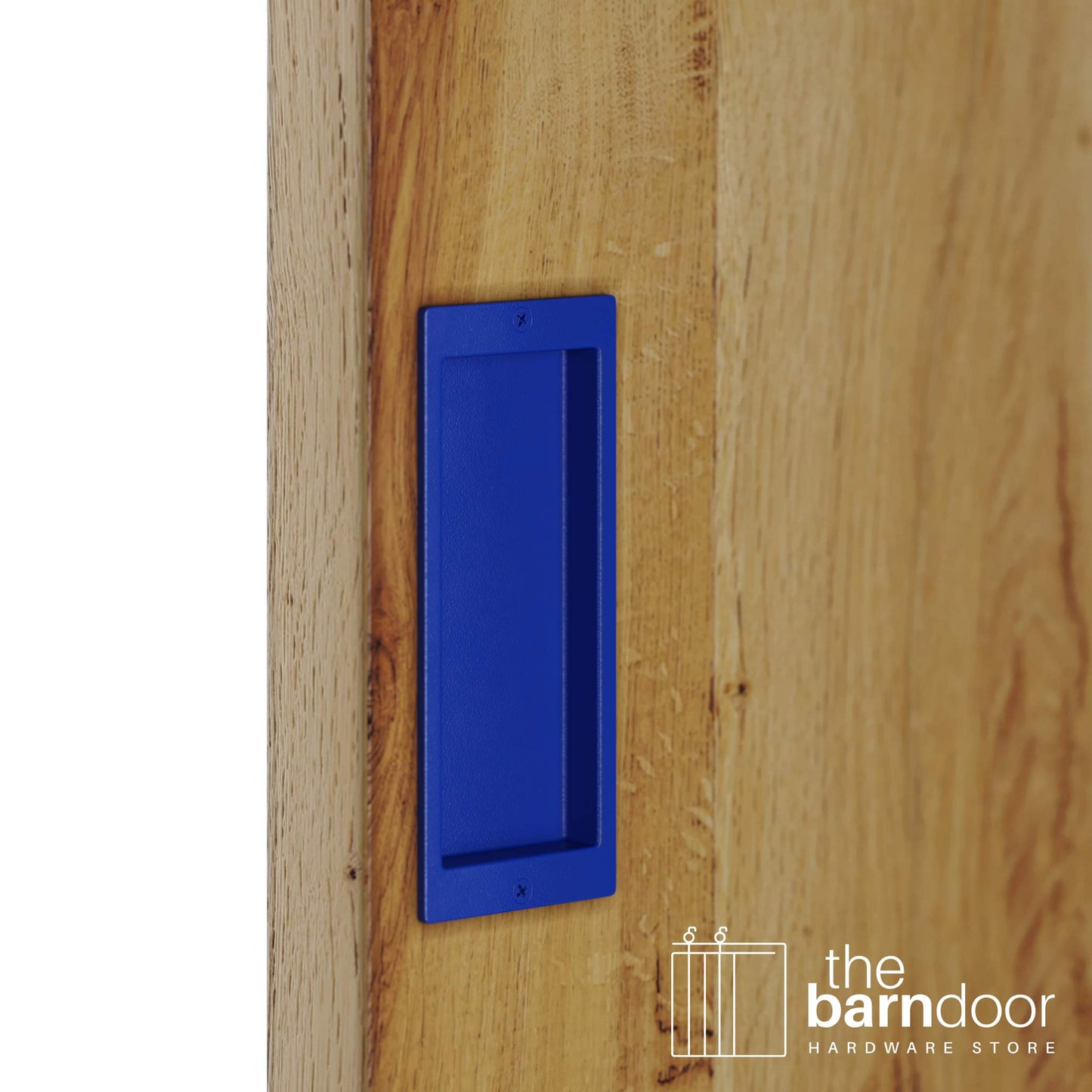 A close-up shot of a recessed rectangular flush pull handle in a blue finish, installed on a light brown wooden barn door.