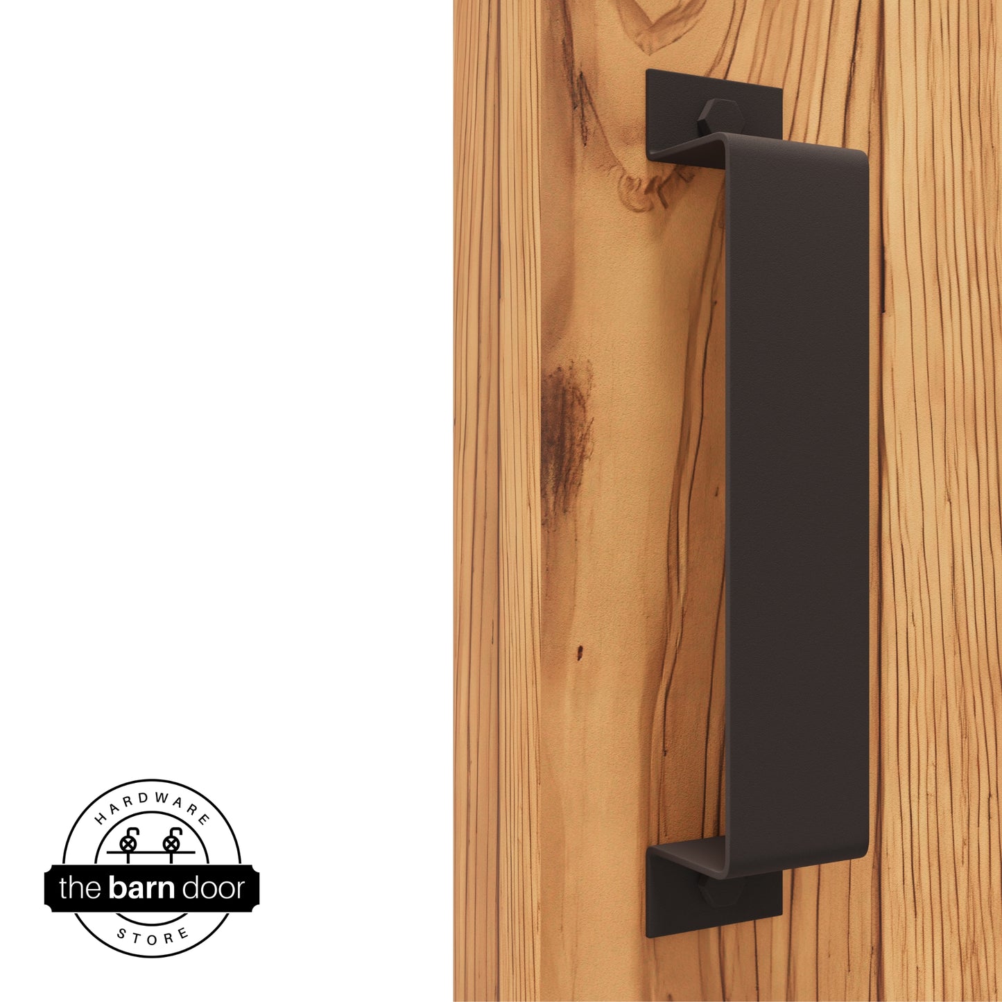 A bronze, arch-shaped barn door handle is mounted on a light-colored wooden door with a vertical grain pattern.